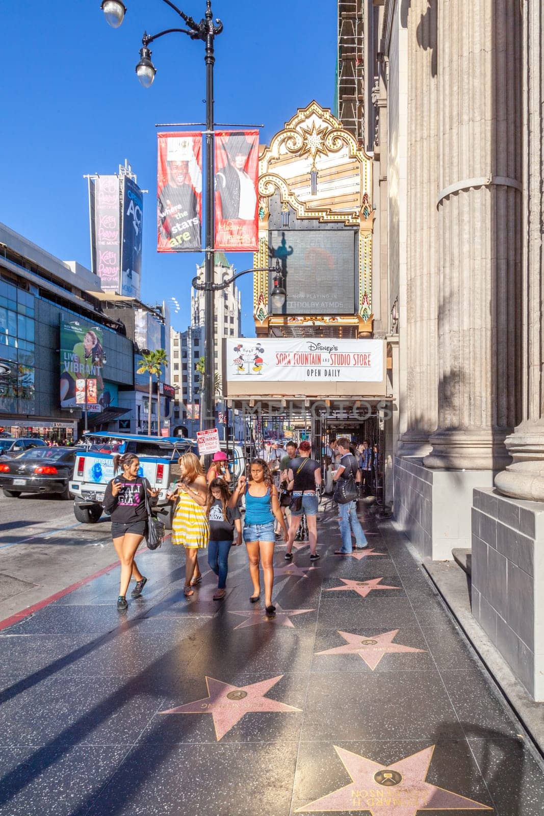 Los Angeles, USA - June 24, 2012: people promenade at the Hollywood boulevard at the walk of fame with thousands of stars from famous Hollywood legends.