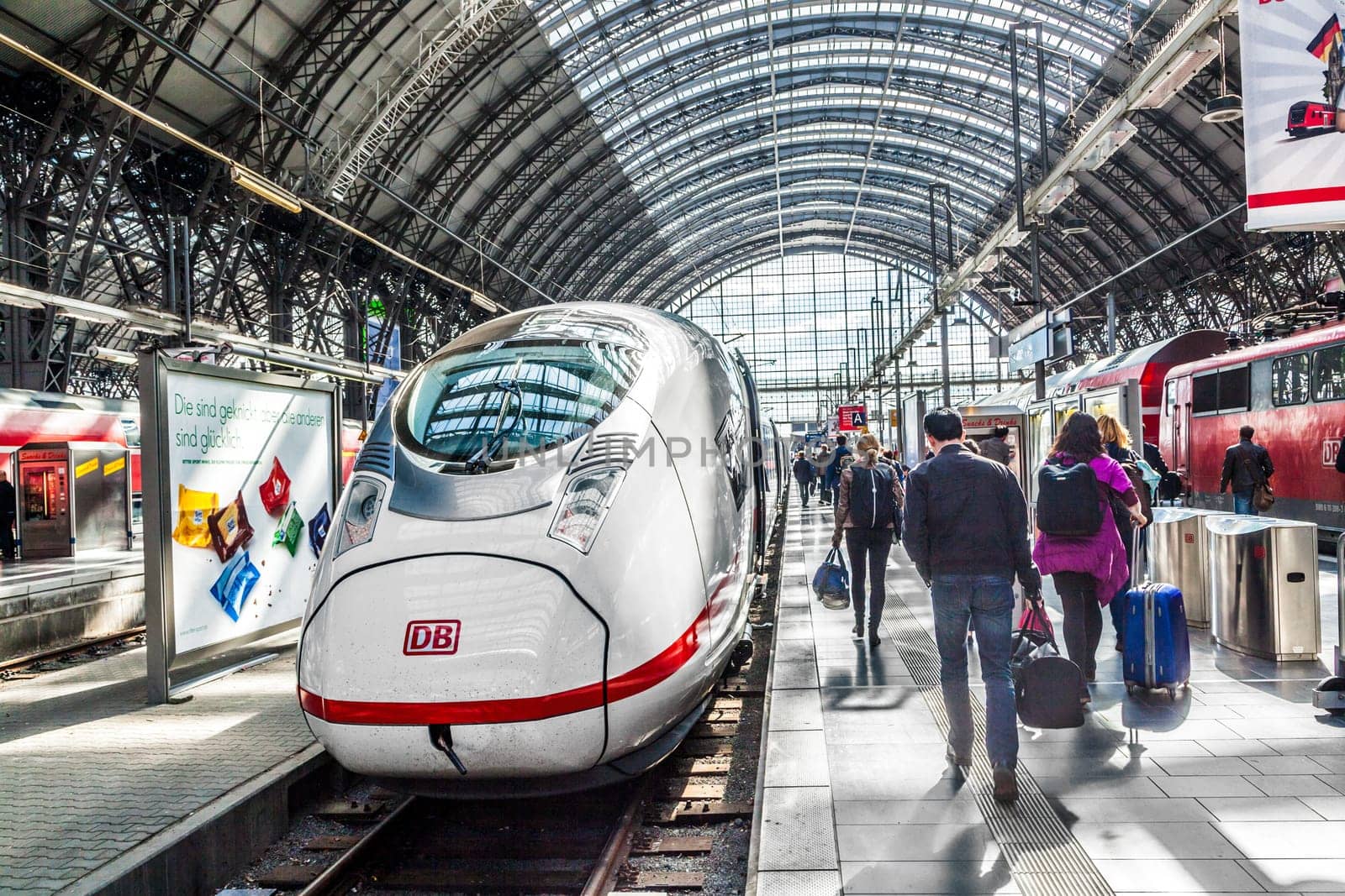 Frankfurt, Germany - May 16, 2014: Inside the Frankfurt central station in Frankfurt, Germany. People hurry to the intercity high speed train.