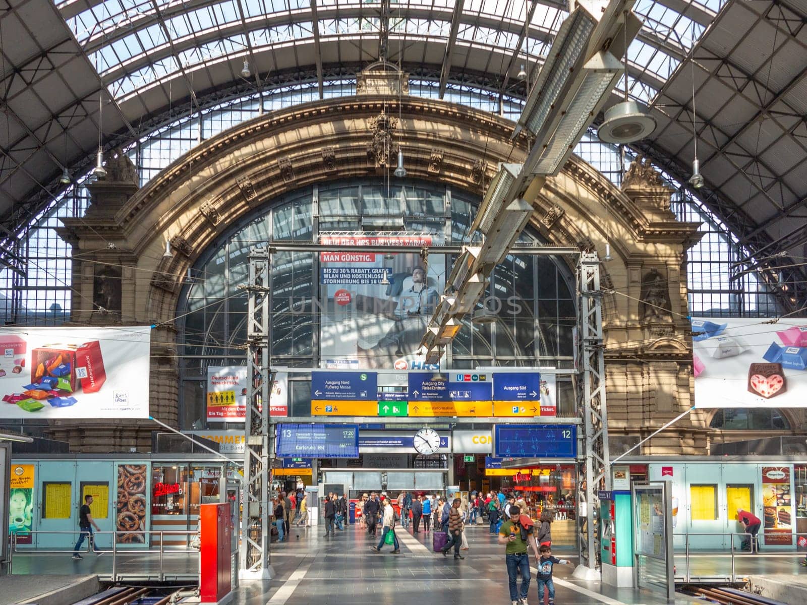 Frankfurt, Germany - May 17, 2014: Inside the Frankfurt central station in Frankfurt, Germany. With about 350.000 passengers per day its the most frequented railway station in Germany.