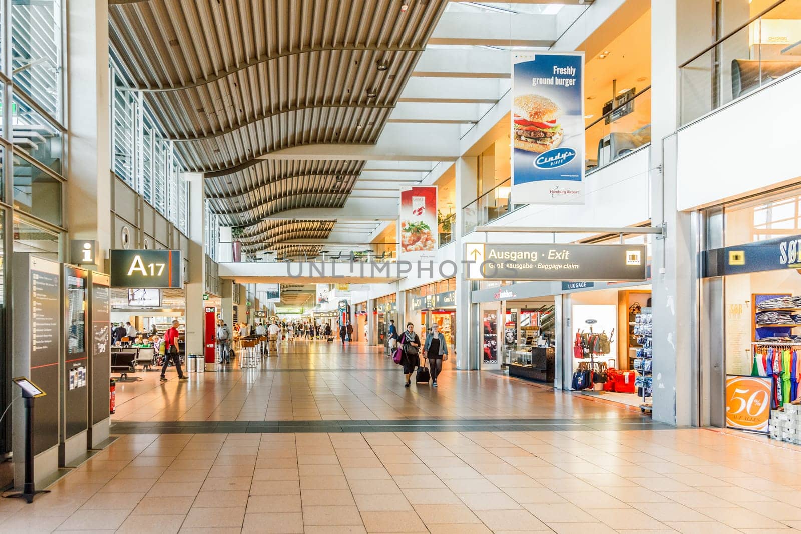 Hamburg, Germany - July 17, 2014: people in the modern Hamburg terminal hurry to the gate for their flight.
