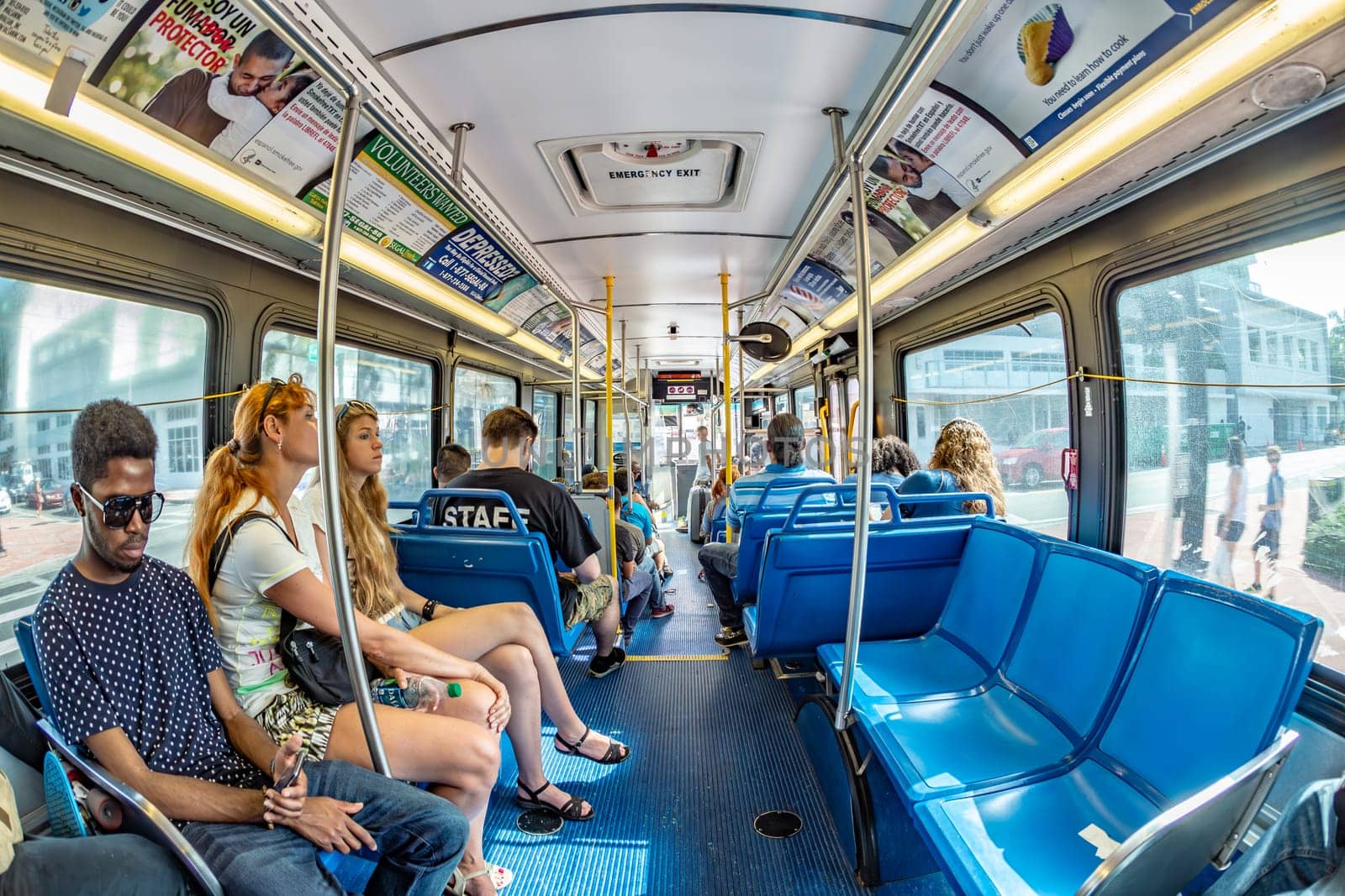 Miami, USA - August 18, 2014: people in the downtown Metro bus in Miami, USA. Metrobus operates more than 90 routes with close to 1,000 buses covering 41 million miles per year.
