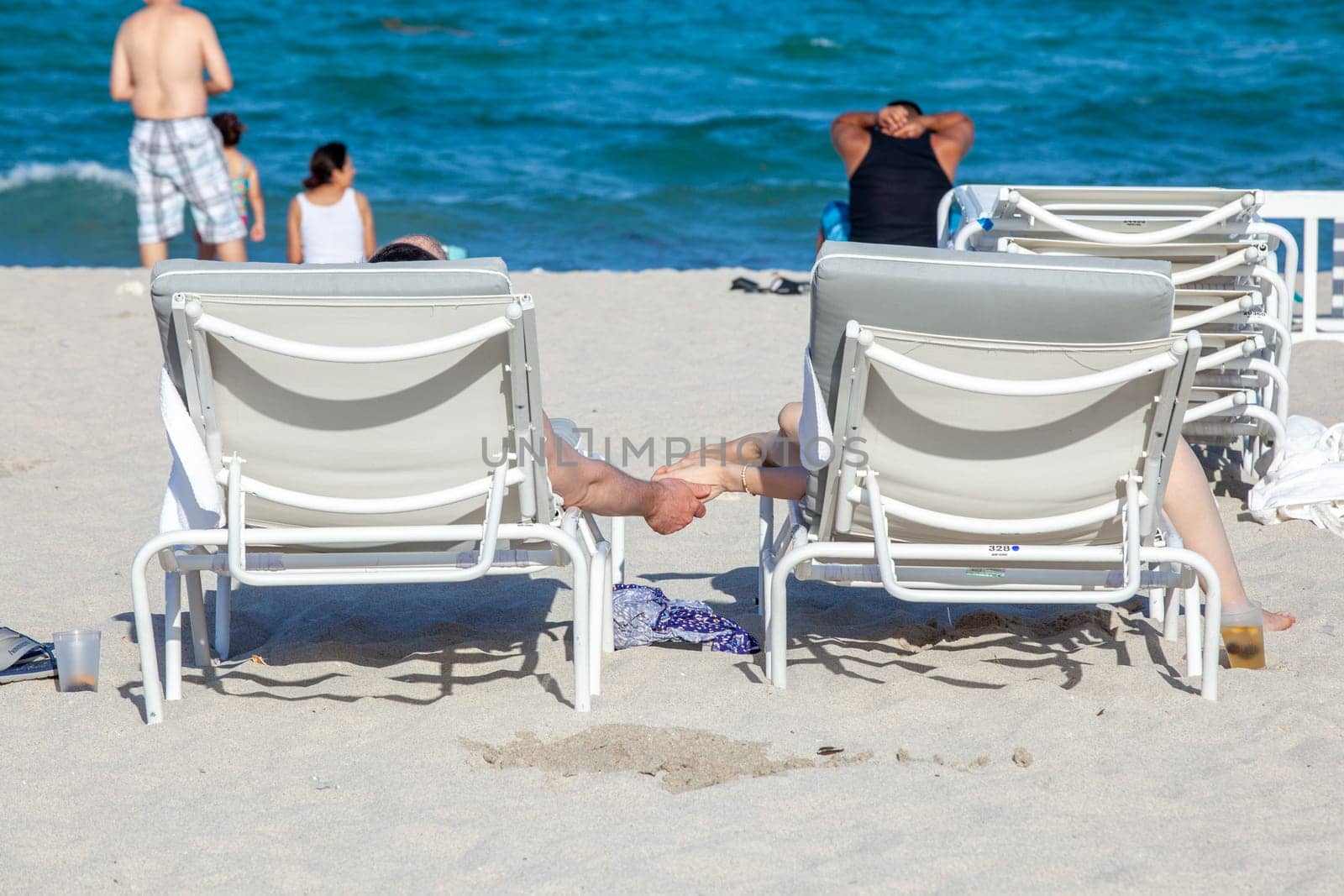 Miami Beach, USA - August 23, 2014: people enjoy the sunny day at south beach in Miami , USA.