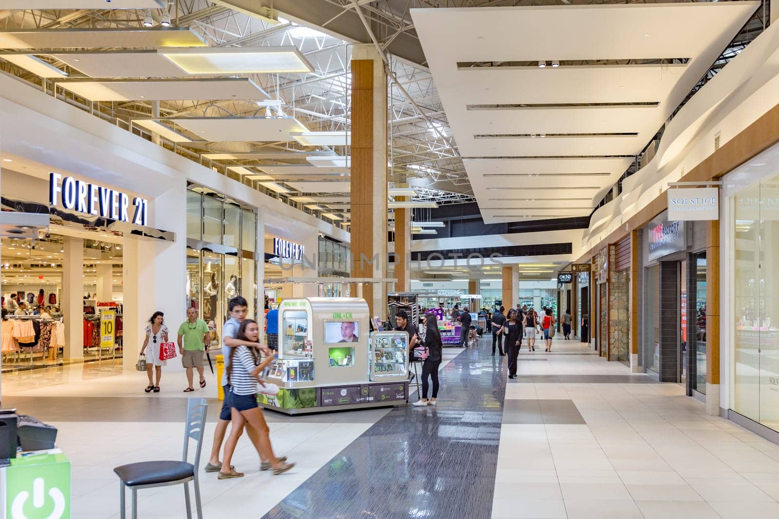 Fort Lauderdale,USA - August 25, 2014: people enjoy shopping in the modern mall Seagrass Mill in Fort Lauderdale.