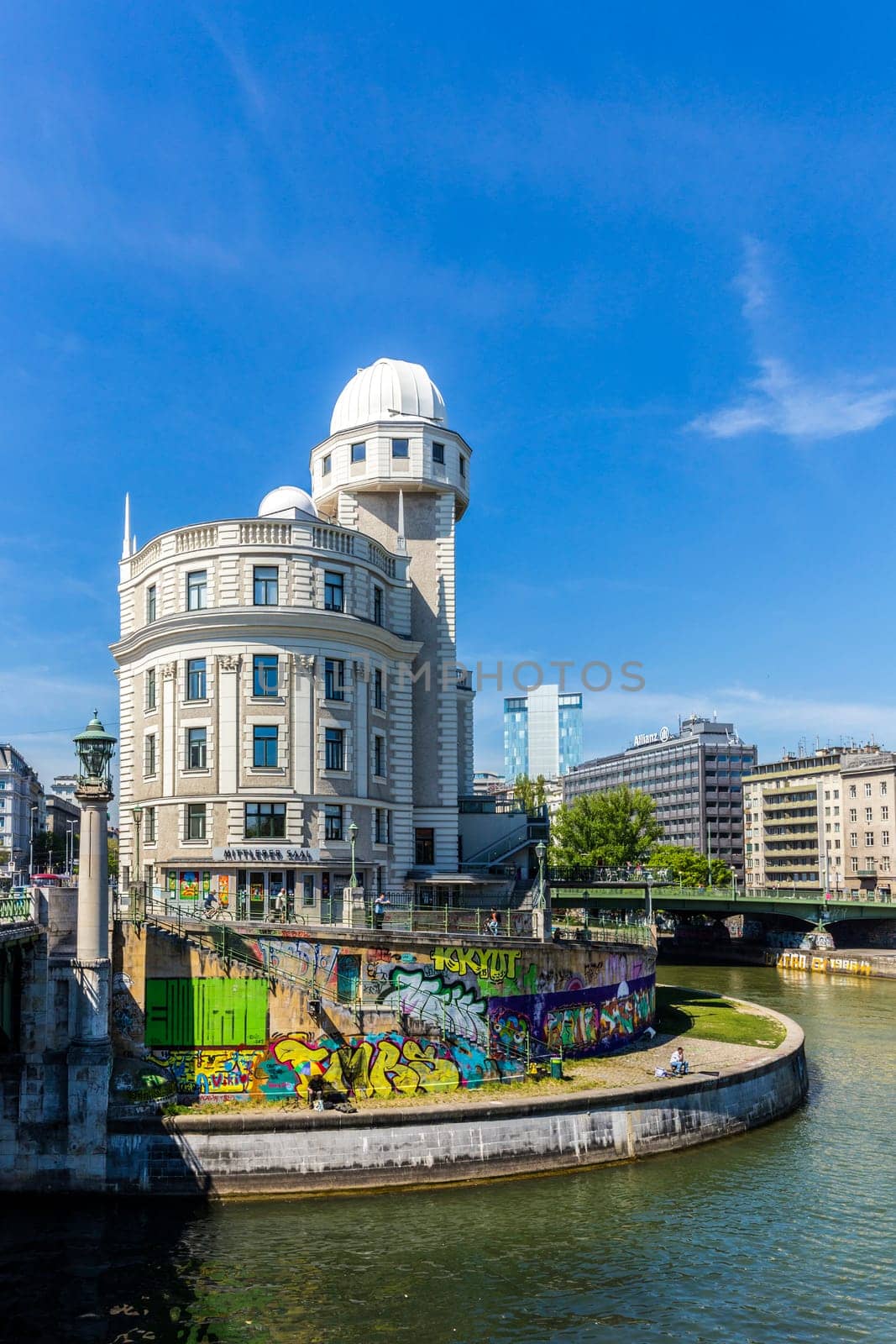 Vienna, Austria - April 25, 2015: people at famous Urania in Vienna. Urania is a public educational institute and observatory  built according to the plans of Art Nouveau style architect Max Fabiani in 1910.