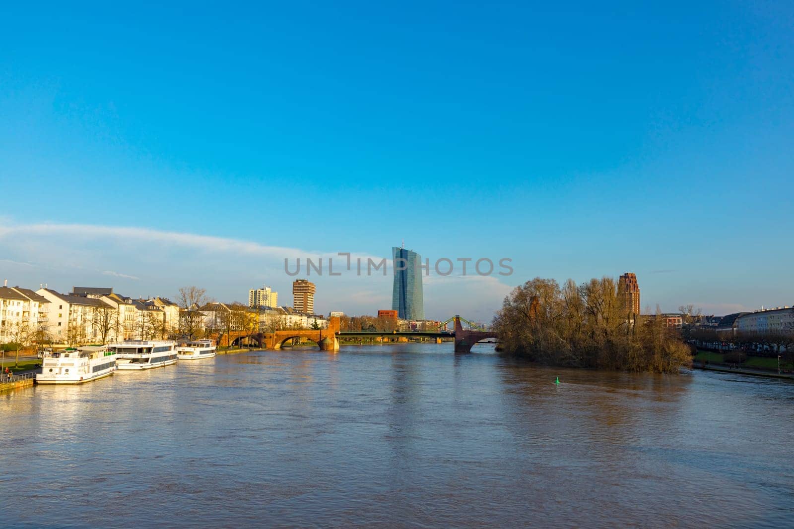 Frankfurt, Germany - January 9, 2018: view to skyline of Frankfurt with new building of European central Bank with river Main.