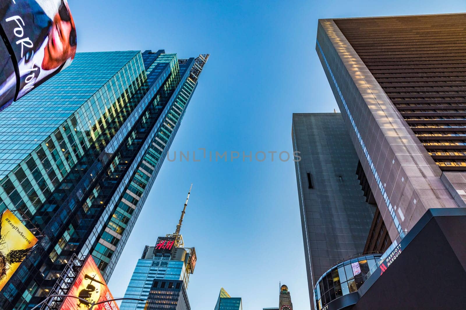 New York, USA - October 4, 2017:    neon advertising of News, brands and theaters at times square in late afternoon. Times square is a symbol for New York life and amusement.