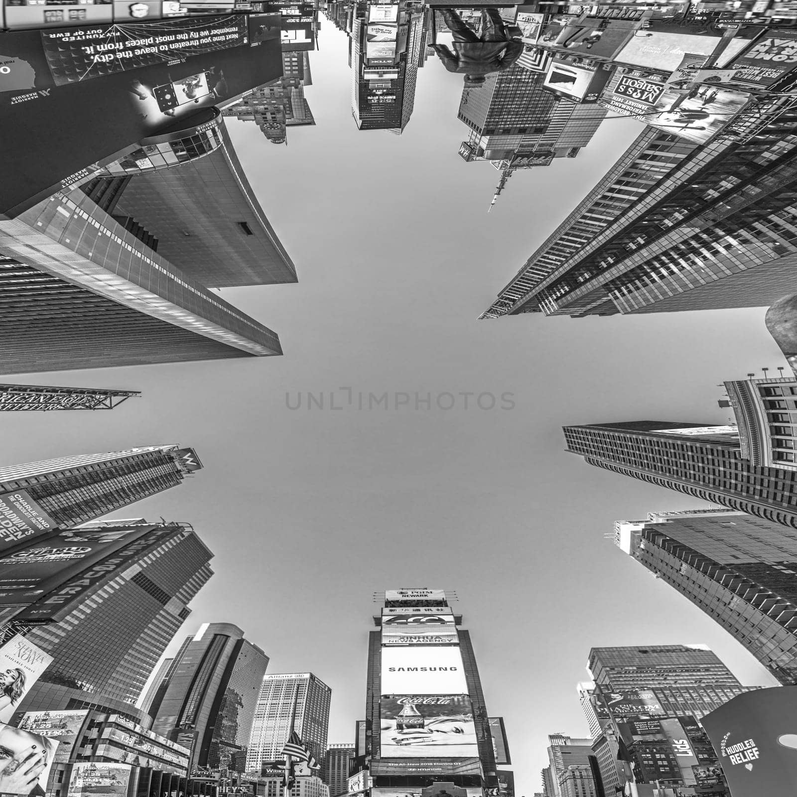 NEW YORK, USA - OCT 4, 2017:  people visit times square with neon advertising of News, brands and theaters   in late afternoon. Times square is a symbol for New York life and amusement.