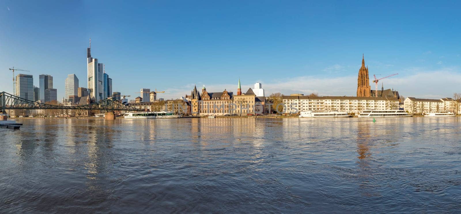 Frankfurt, Germany - January 9, 2018: panoramic view of Frankfurt am Main with view to modern skyscraper and the historic dome at river Main.