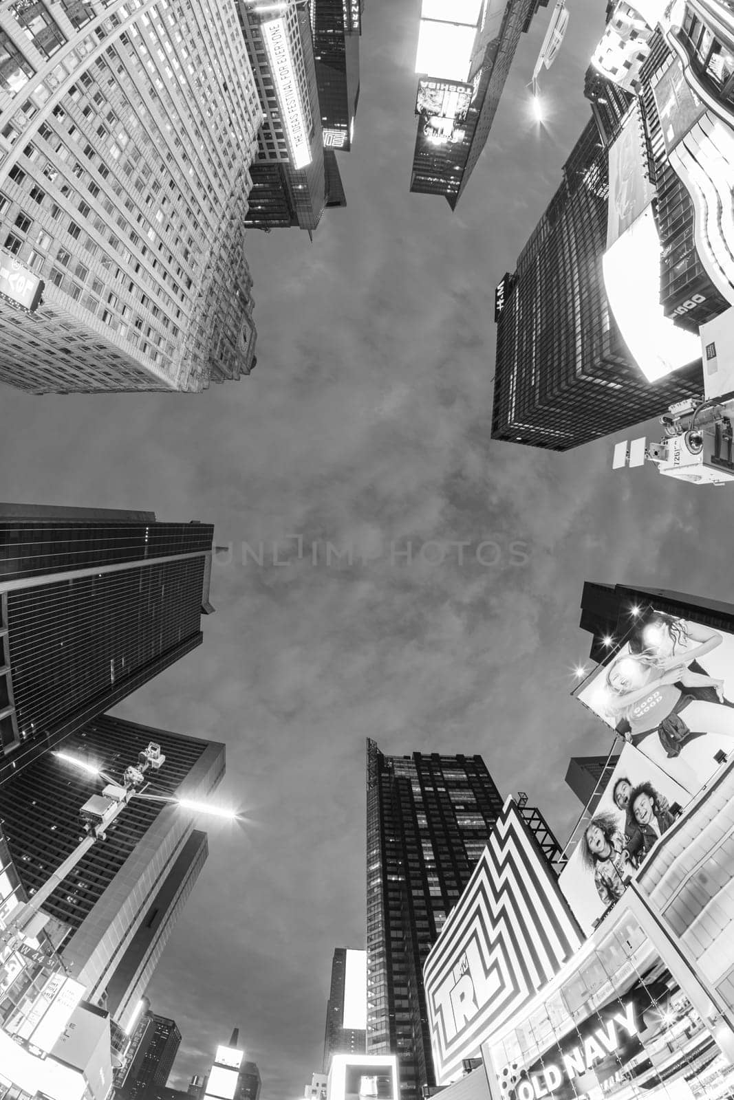NEW YORK, USA  OCT 4, 2017:  neon advertising of News, brands and theaters at times square in late afternoon. Times square is a symbol for New York life and amusement.