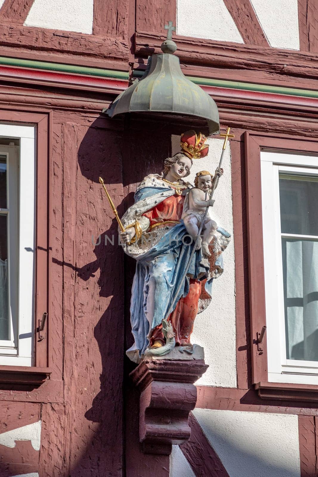Miltenberg, Germany - April 6, 2018: Virgin Mary, statue on the main street of Miltenberg in Lower Franconia, Bavaria, Germany.