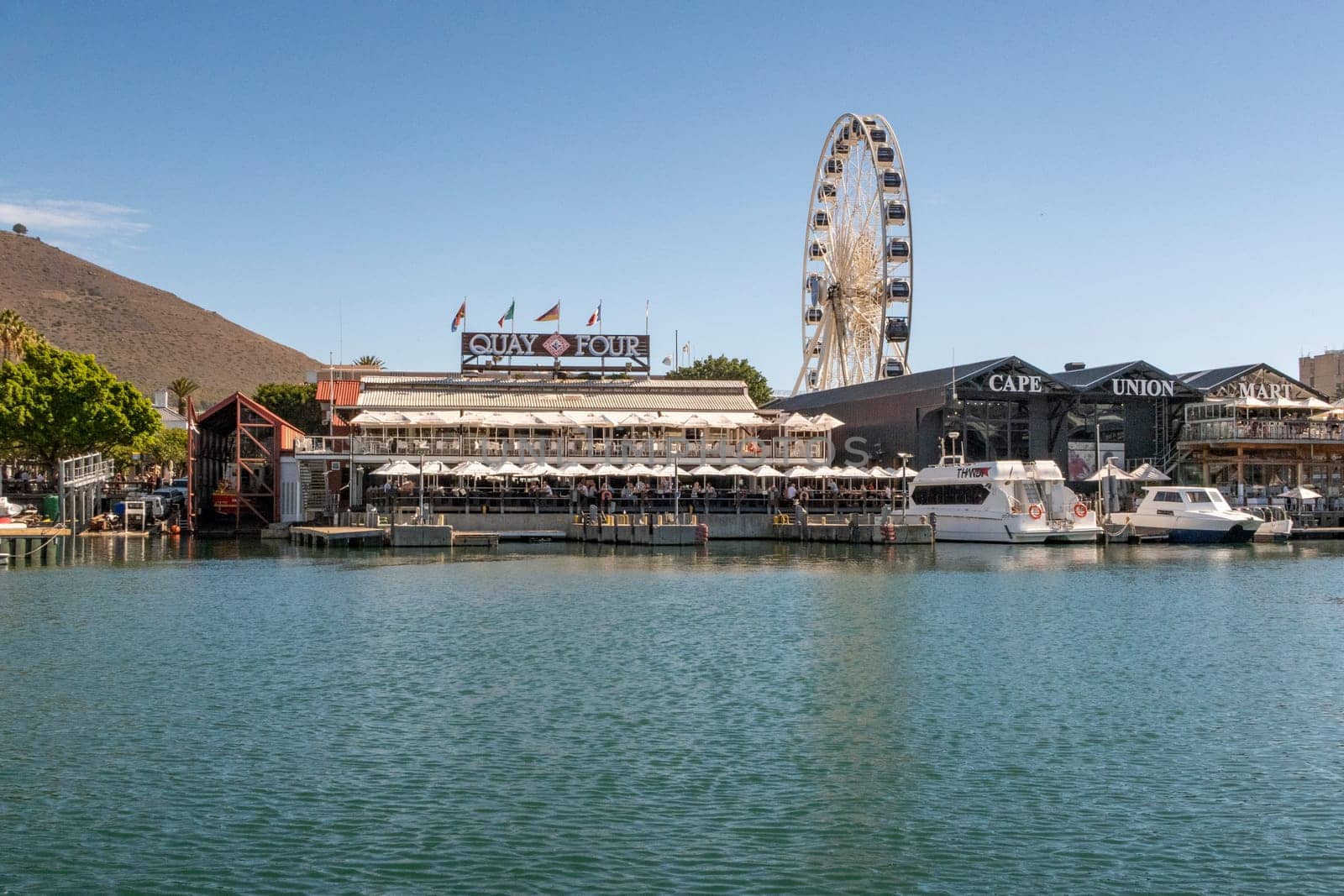 Cape Town, South Africa - April 16, 2018: big wheel as tourist attraction in the harbor of Cape Town, South Africa.