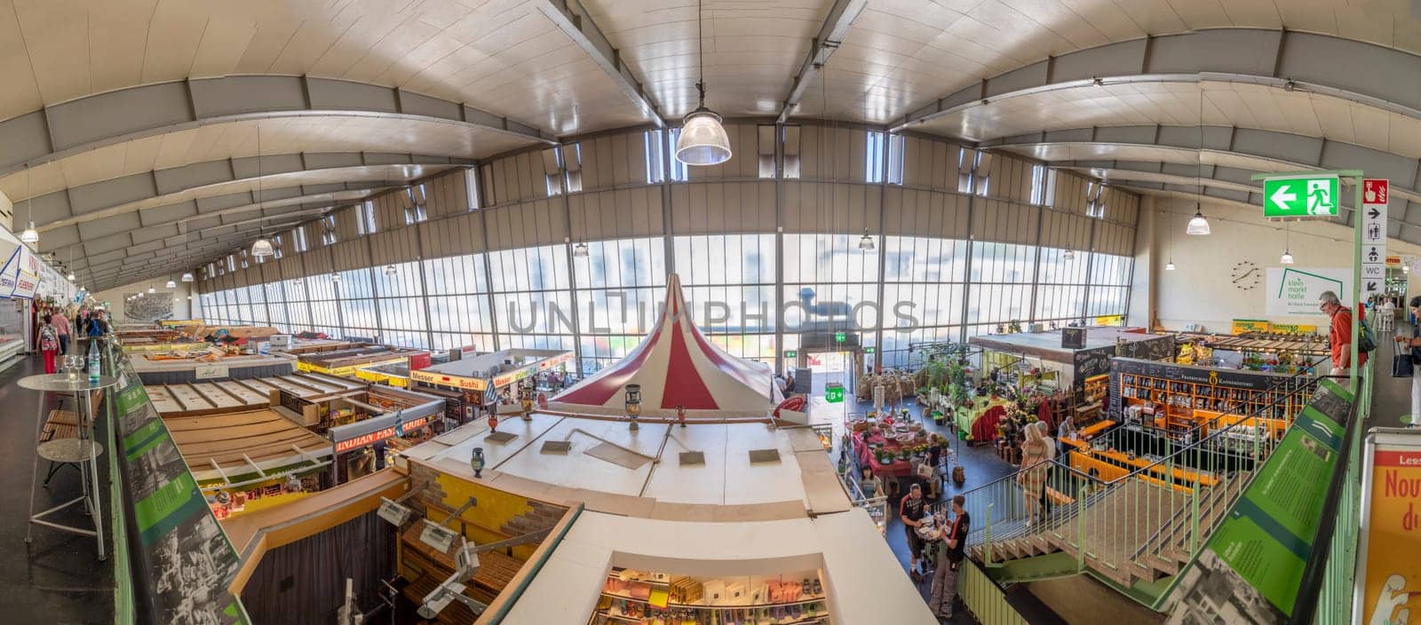 Frankfurt, Germany - July 19, 2018: people enjoy shopping in the Kleinmarkthalle in Frankfurt, Germany. The hall from 1954 is the most famous fresh food market in Frankfurt on 1500 SQ (m2).