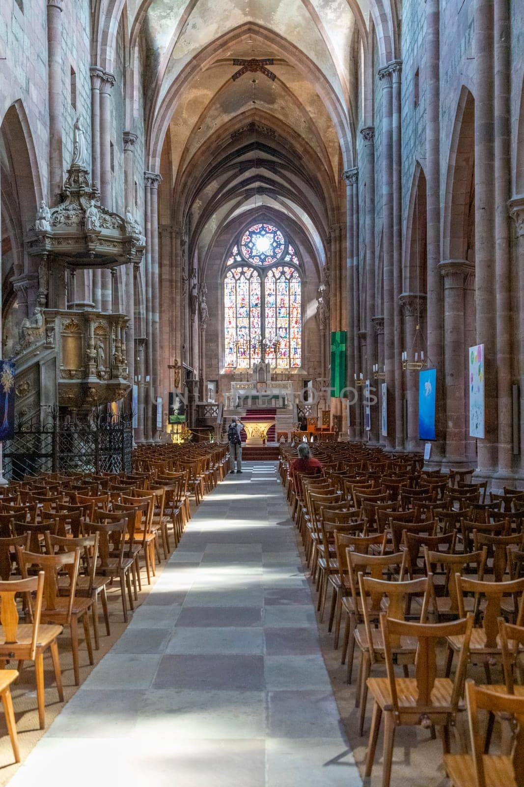 Selestat, France - June 23, 2018: inside St. Faiths  church with colorful windows in Selestat. The church dates back to 12th century.