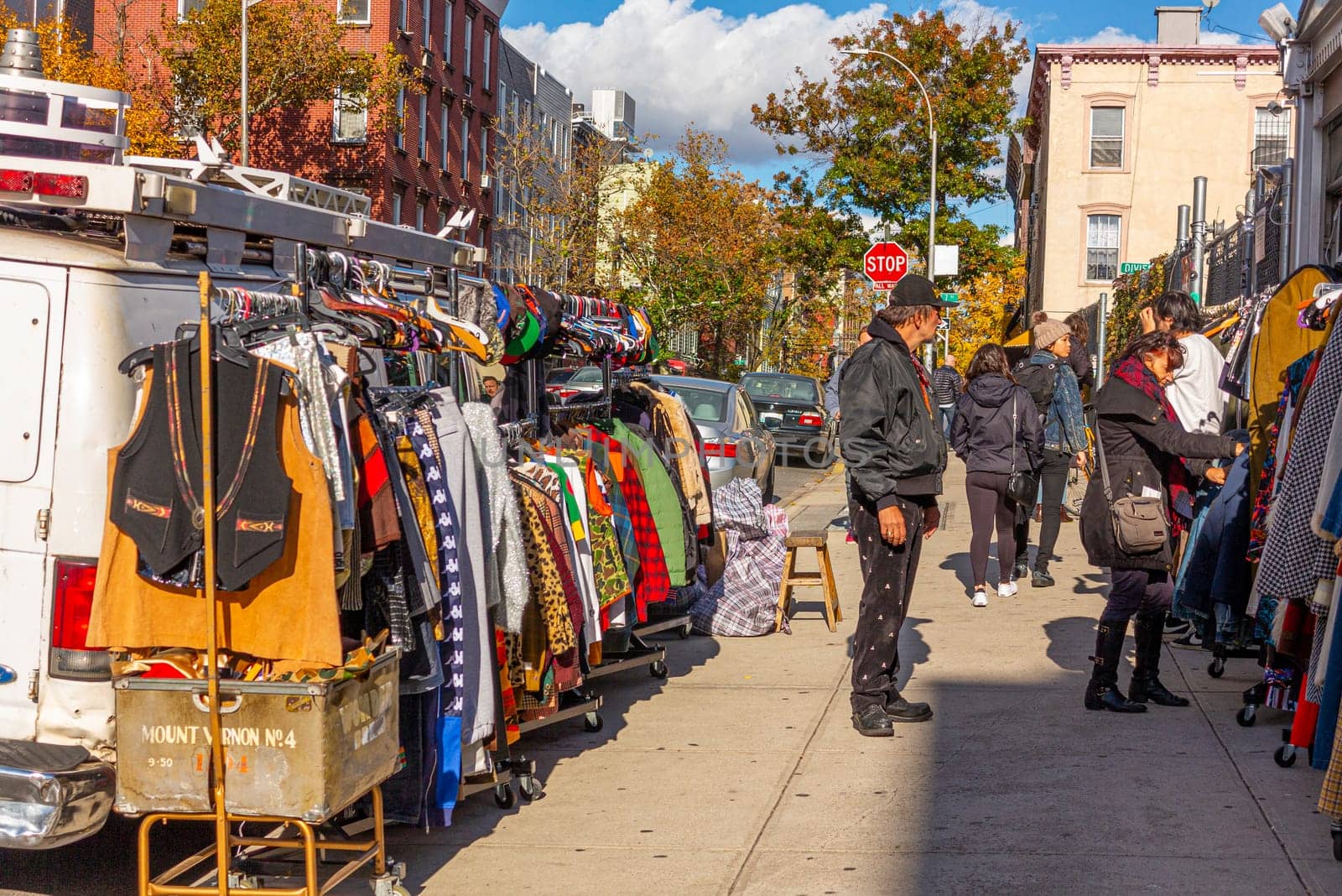 New York, USA - November 11, 2018: people selling second hand clothes at the street in Brooklyn, New York.