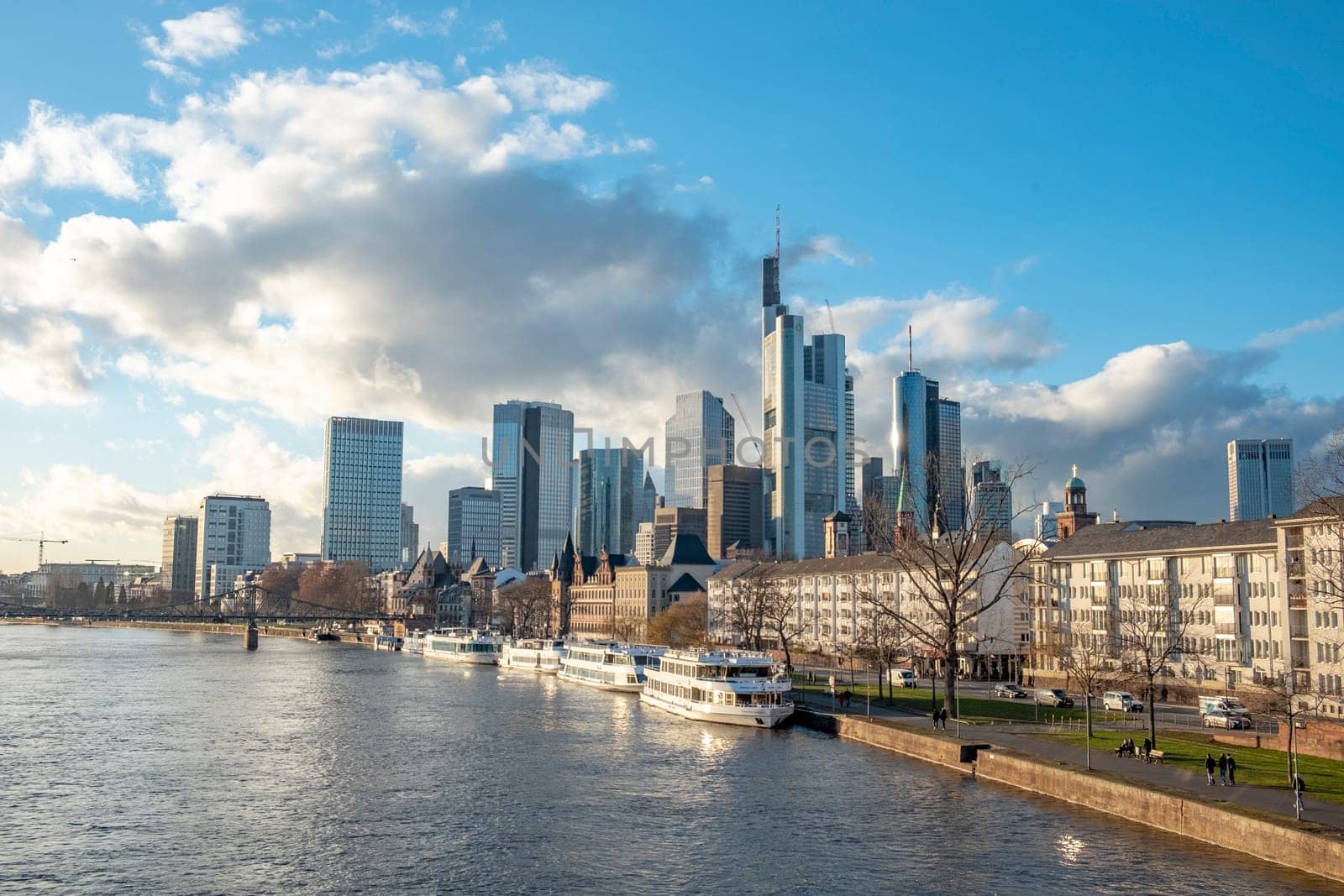 Frankfurt, Germany - January 14, 2019: skyline of Frankfurt am Main with ships on river Main.
