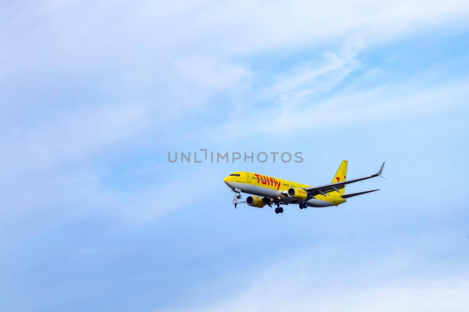Frankfurt, Germany - April 4, 2019: aircraft of TUI Fly in landing approach at Frankfurt international airport.
