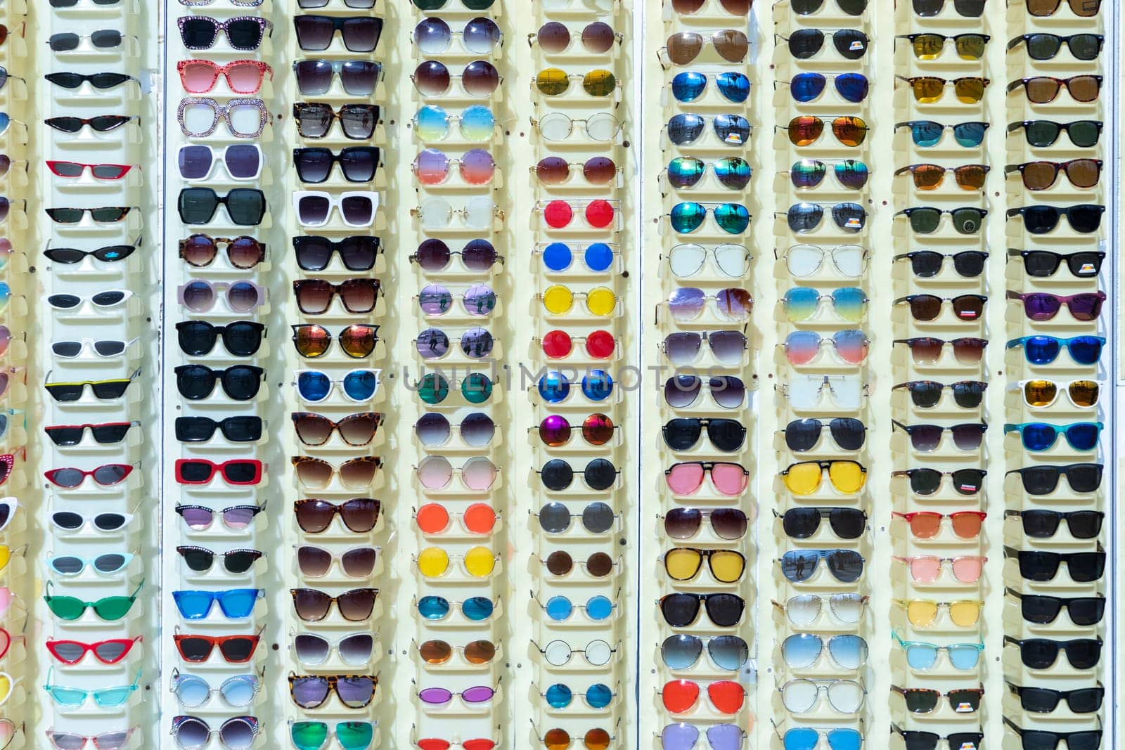 Venice, USA - March 5, 2019: sunglasses in a rack in different colors sold at beach promenade in Venice Beach.
