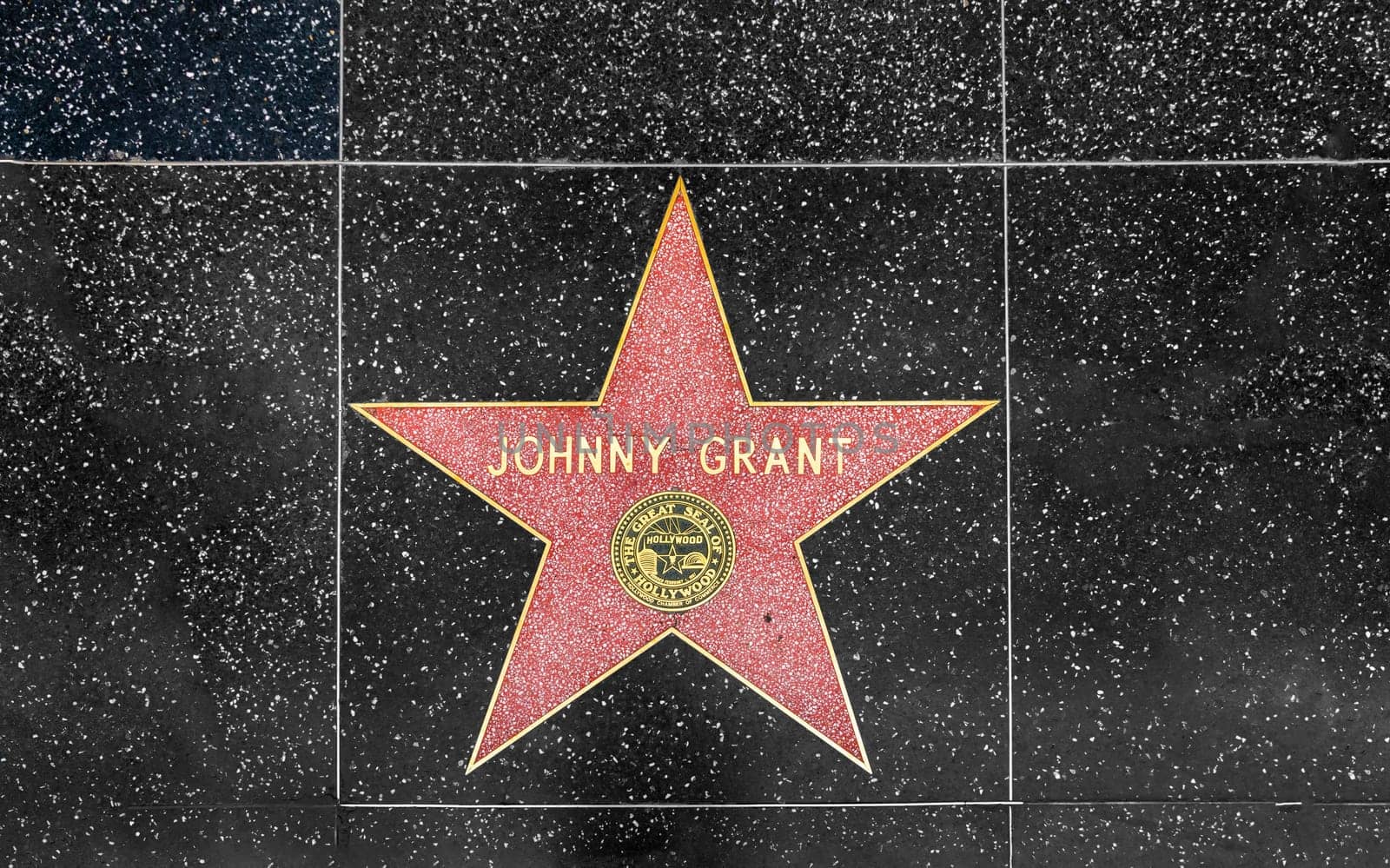 Los Angeles, USA - March 5, 2019: closeup of Star on the Hollywood Walk of Fame for Johnny Grant.