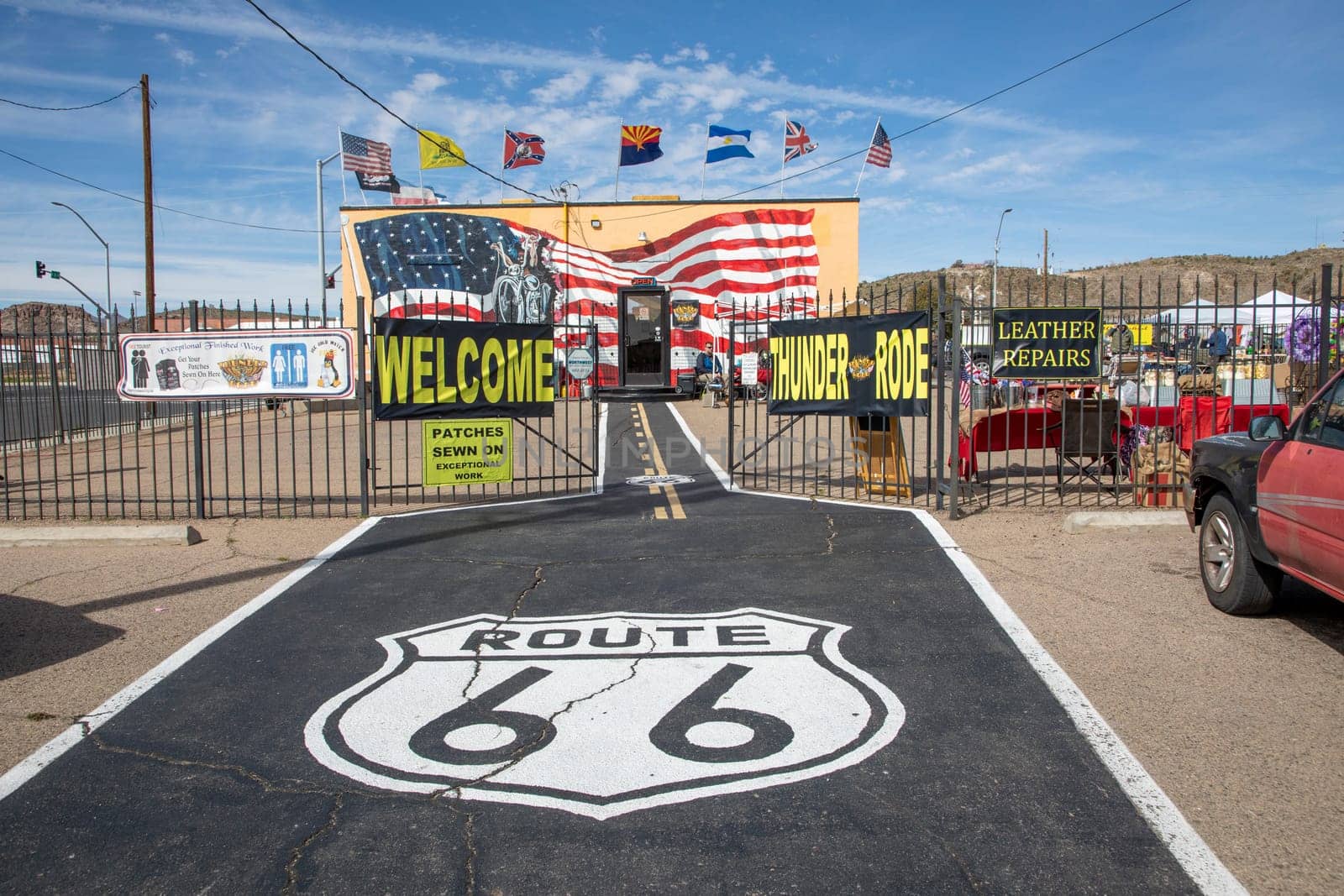 Flagstaff, USA - March 9, 2019: scenic view to shop selling Route 66 souvenirs and emblem from route 66 at bitumen floor.