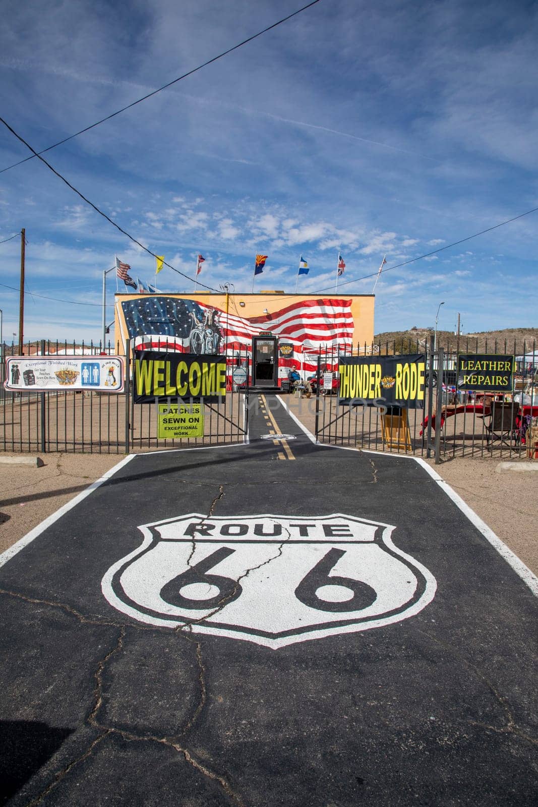 Flagstaff, USA - March 9, 2019: scenic view to shop selling Route 66 souvenirs and emblem from route 66 at bitumen floor.