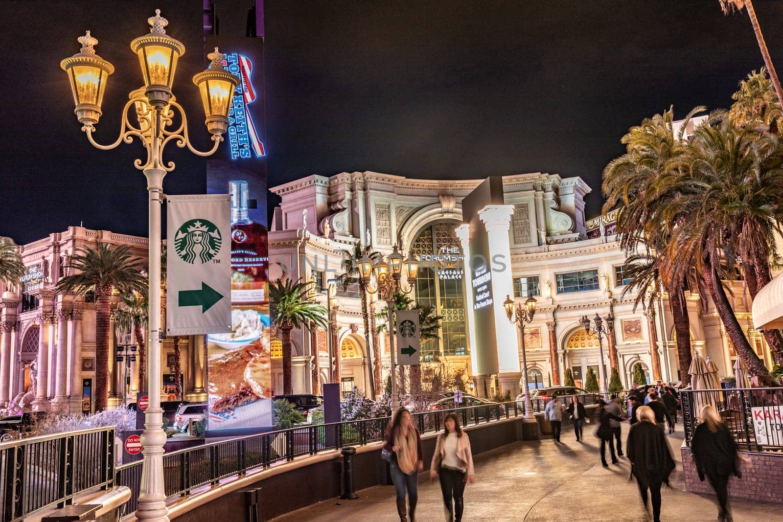Las Vegas,  USA - March 3, 2019: Neon lights at the shopping mall the Forum and Hotel and Casino at the Las Vegas Strip at night.