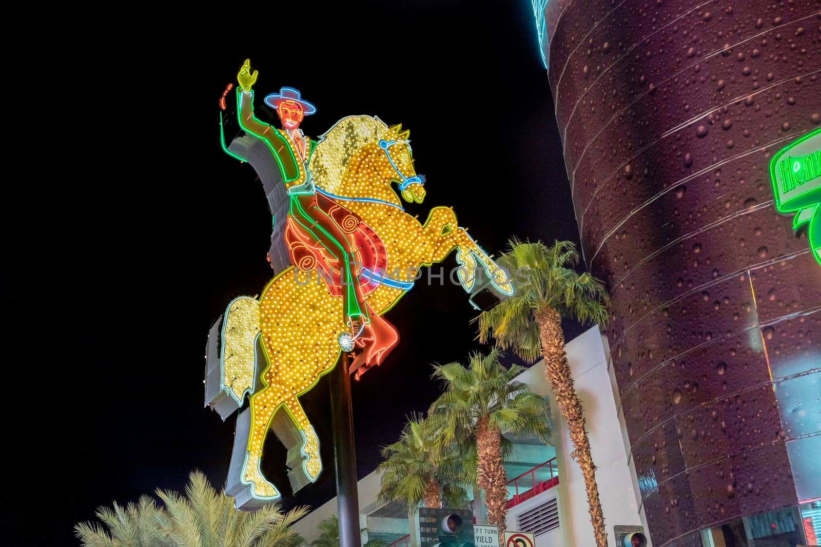 Las Vegas, USA - March 9, 2019: view to cowboy Vic in the Fremont street by night, illuminated by light bulbs in Las Vegas, USA.