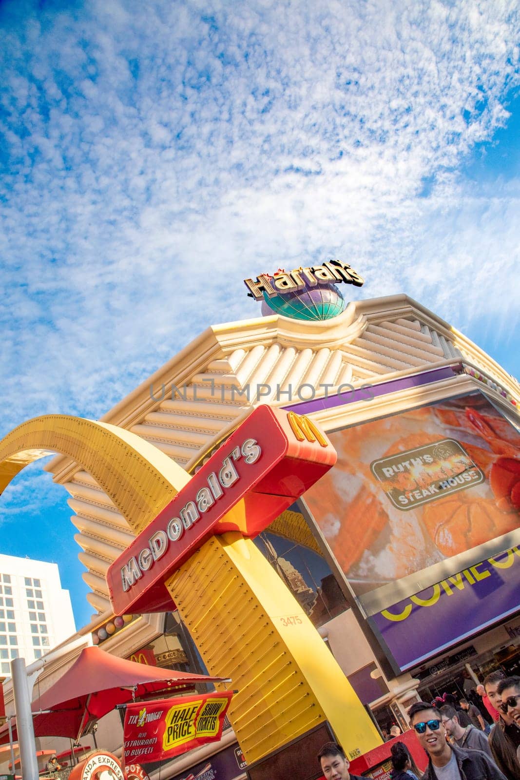 Las Vegas, USA - March 9, 2019: view to facade of Harrah's casino and advertising for McDonald's at the strip in Las Vegas, USA.