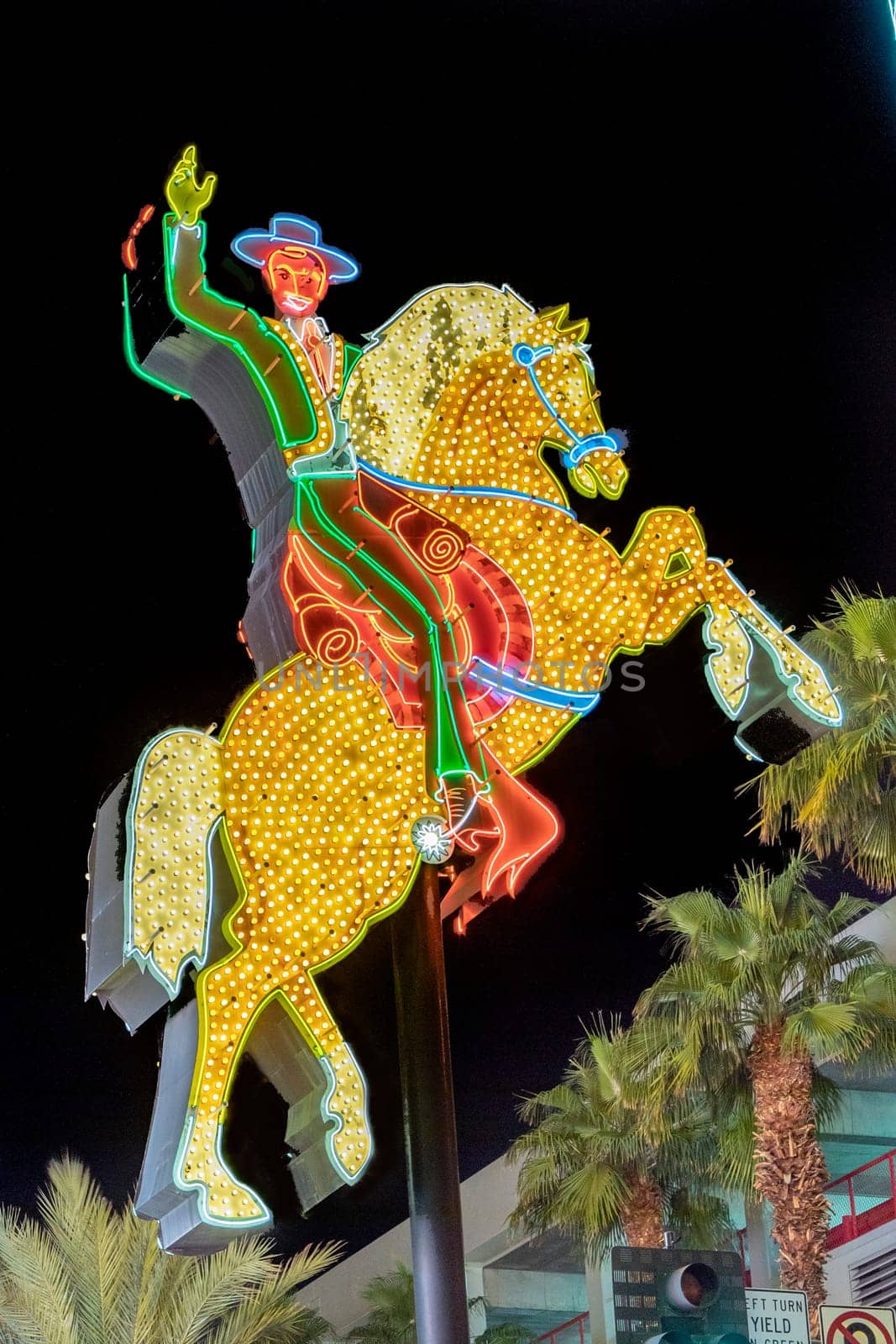 Las Vegas, USA - March 9, 2019: view to cowboy Vic in the Fremont street by night, illuminated by light bulbs in Las Vegas, USA.