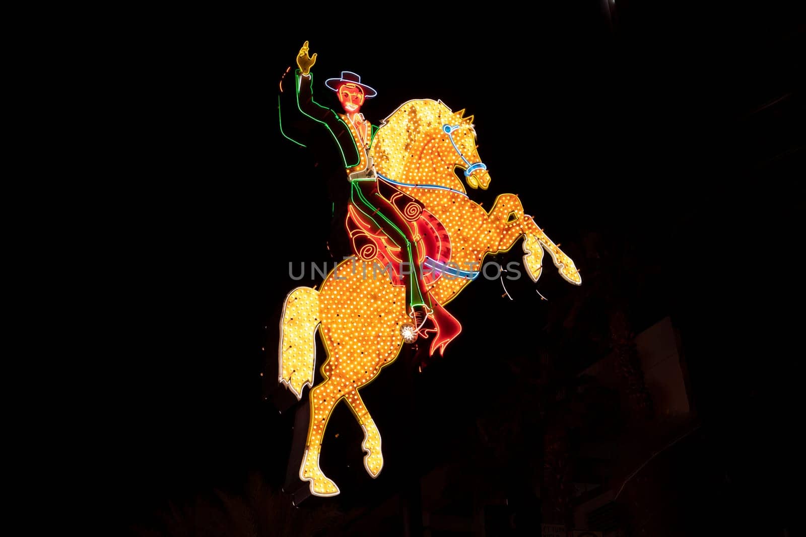 Las Vegas, USA  - March 9, 2019: cowboy neon signs at Fremont East District of Las Vegas