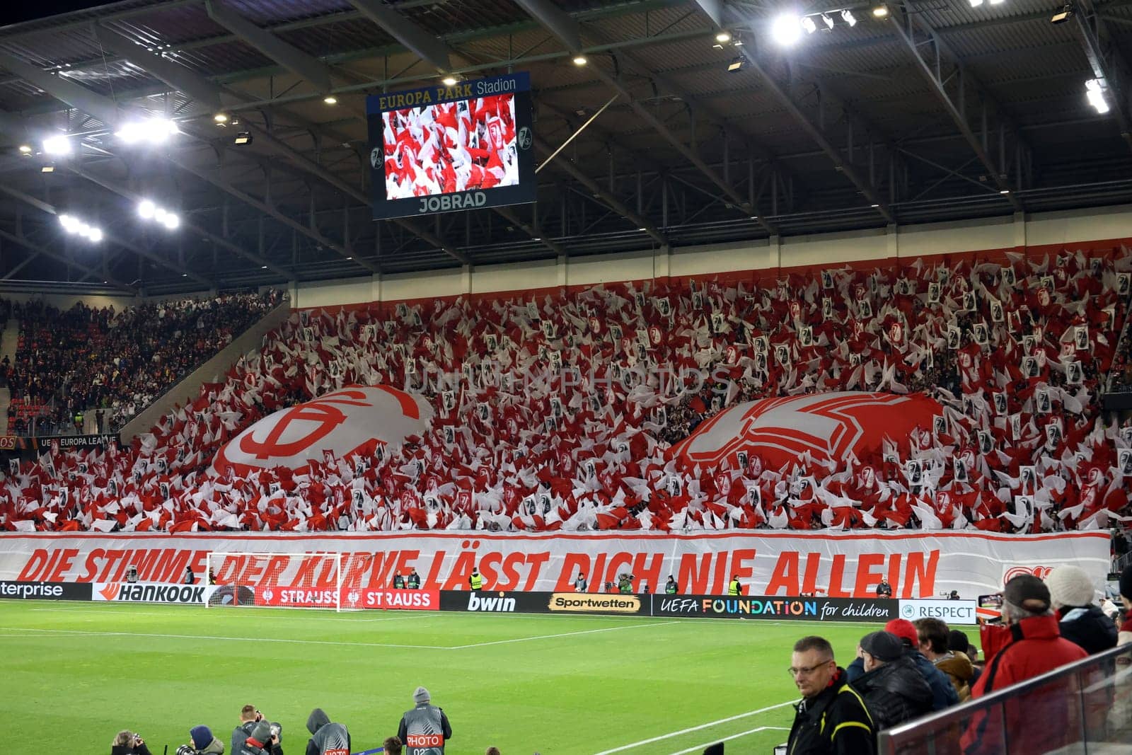 Successful choreography: The South Stand in red and white as the 12th man for the team at the match of the Football Europa League - Qualification 1/8 Final,SC Freiburg vs RC Lens