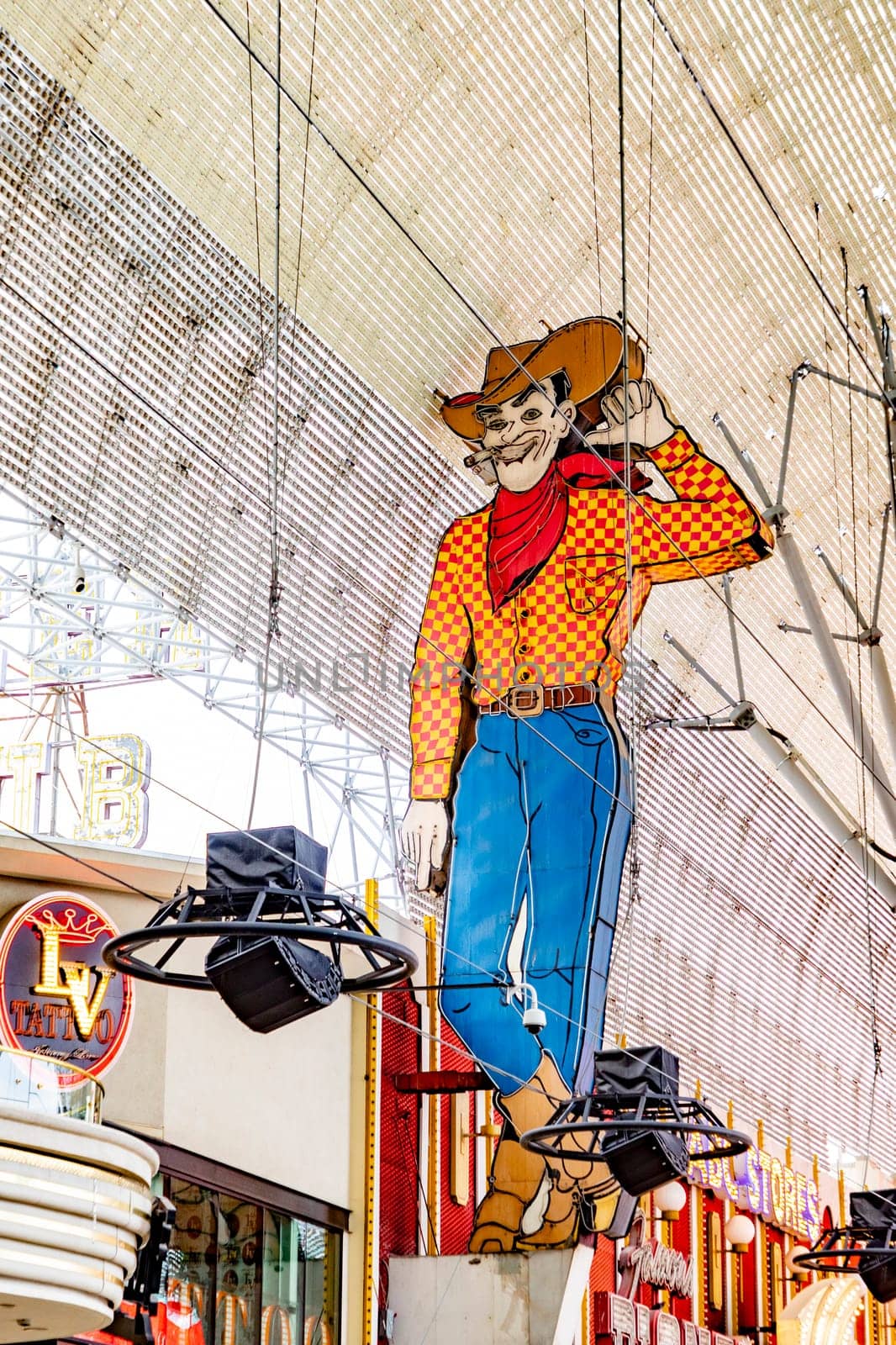 Las Vegas, USA - MAR 10, 2019: Famous cowboy neon sign at high above the Fremont Street.