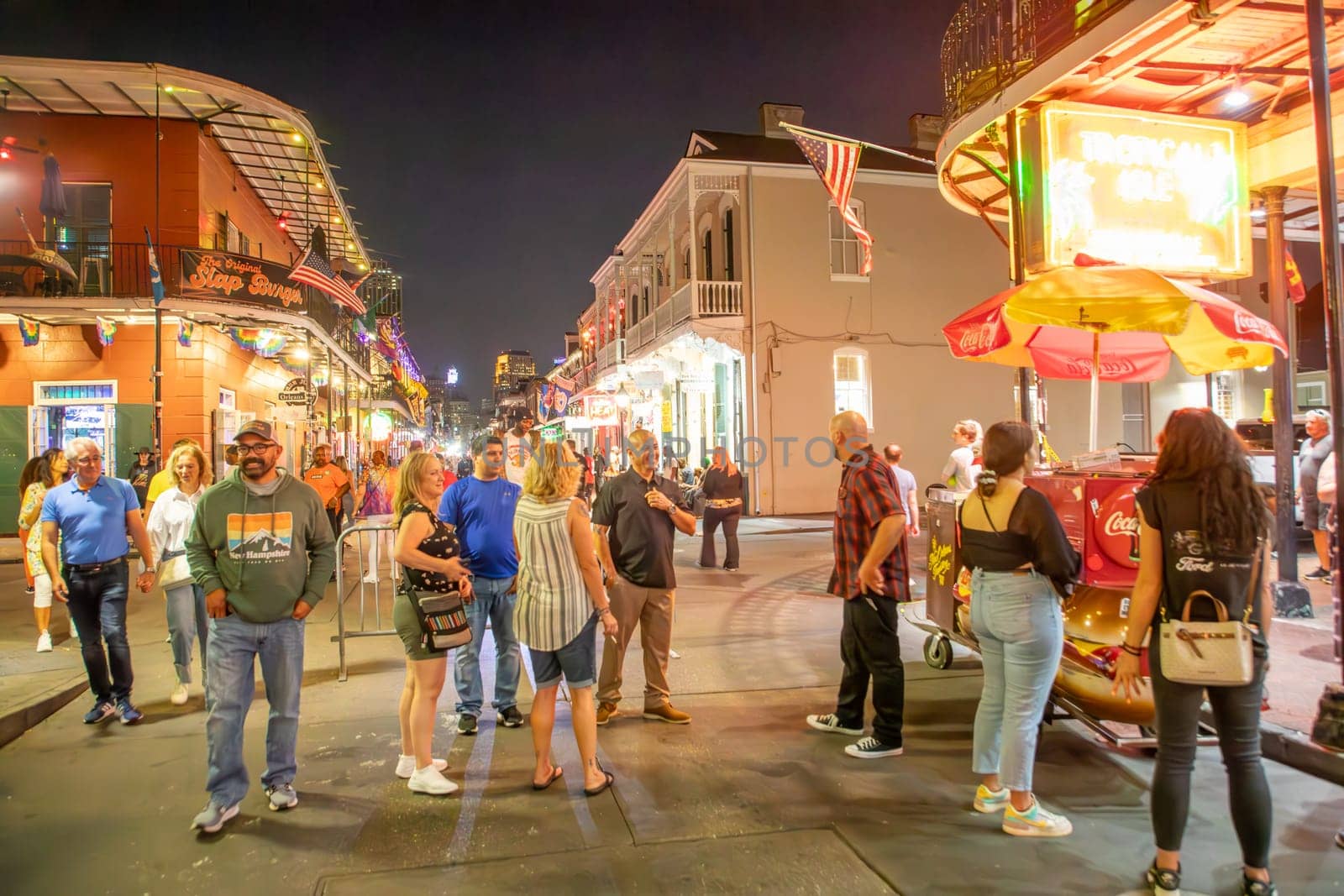 New Orleans  USA - October 24, 2023: people visit Pubs and bars with neon lights in the French Quarter, downtown New Orleans.