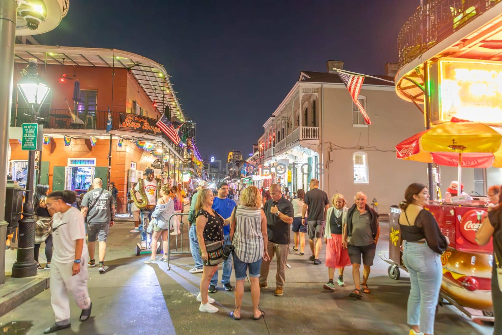 New Orleans  USA - October 24, 2023: people visit Pubs and bars with neon lights in the French Quarter, downtown New Orleans.