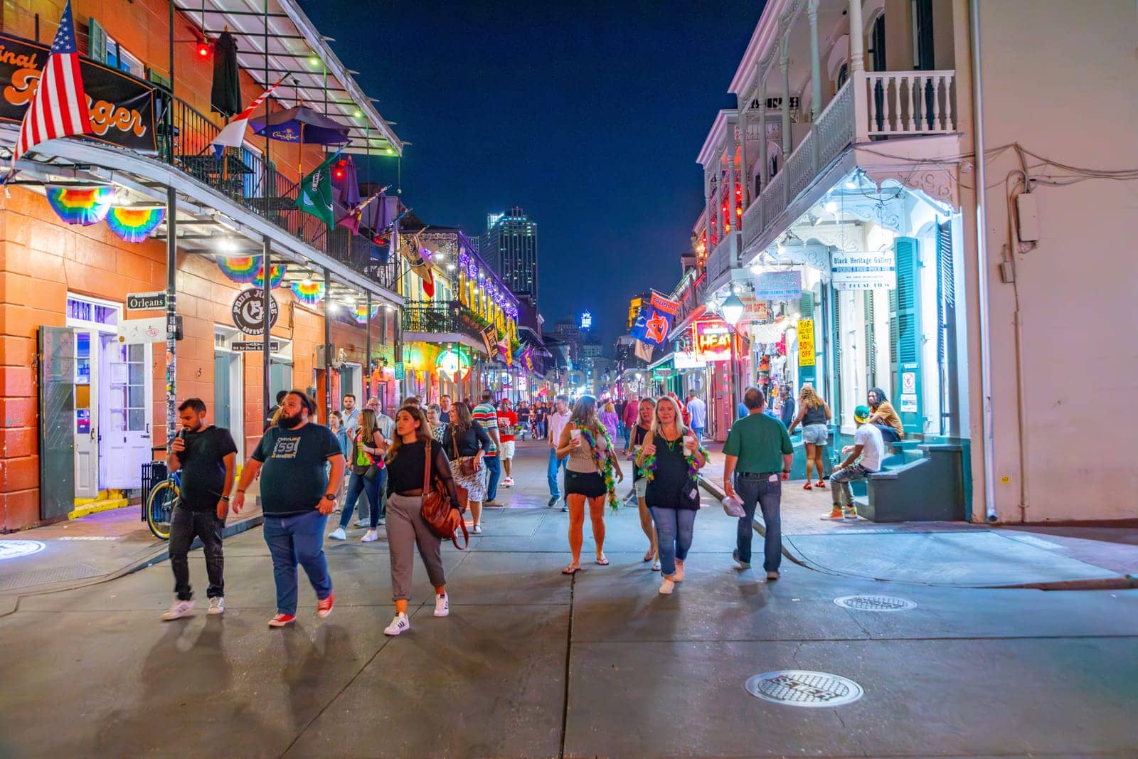 New Orleans  USA - October 25, 2023: people enjoy the clubs, musik, street life at the Bourbon street in the french quarter in New Orleans by night.