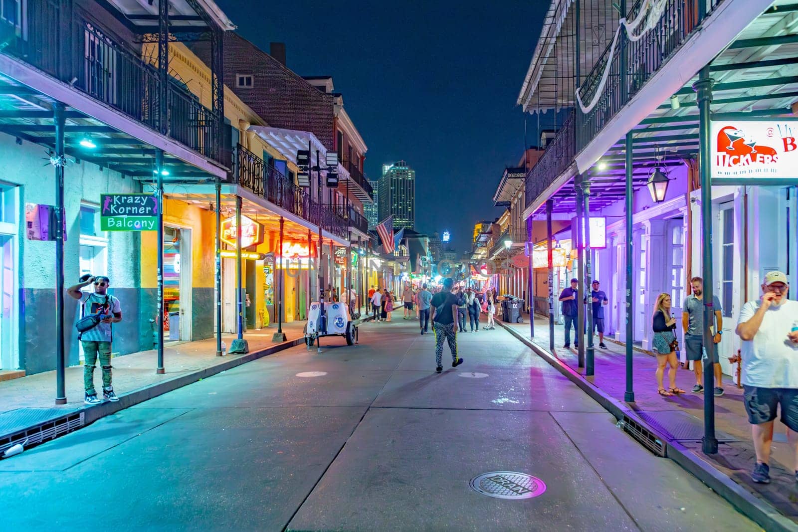 New Orleans  USA - October 25, 2023: people enjoy the clubs, musik, street life at the Bourbon street in the french quarter in New Orleans by night.