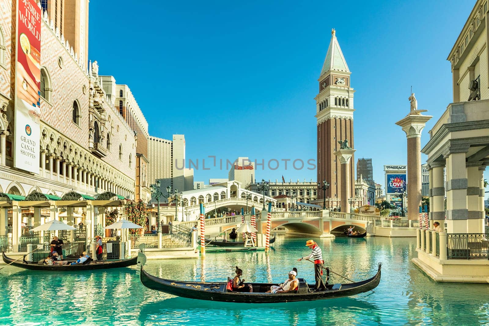 Las Vegas, USA - May 24, 2022: people enjoy a gondola ride at the Hotel and Casino The Venetian with singing gondolieres.