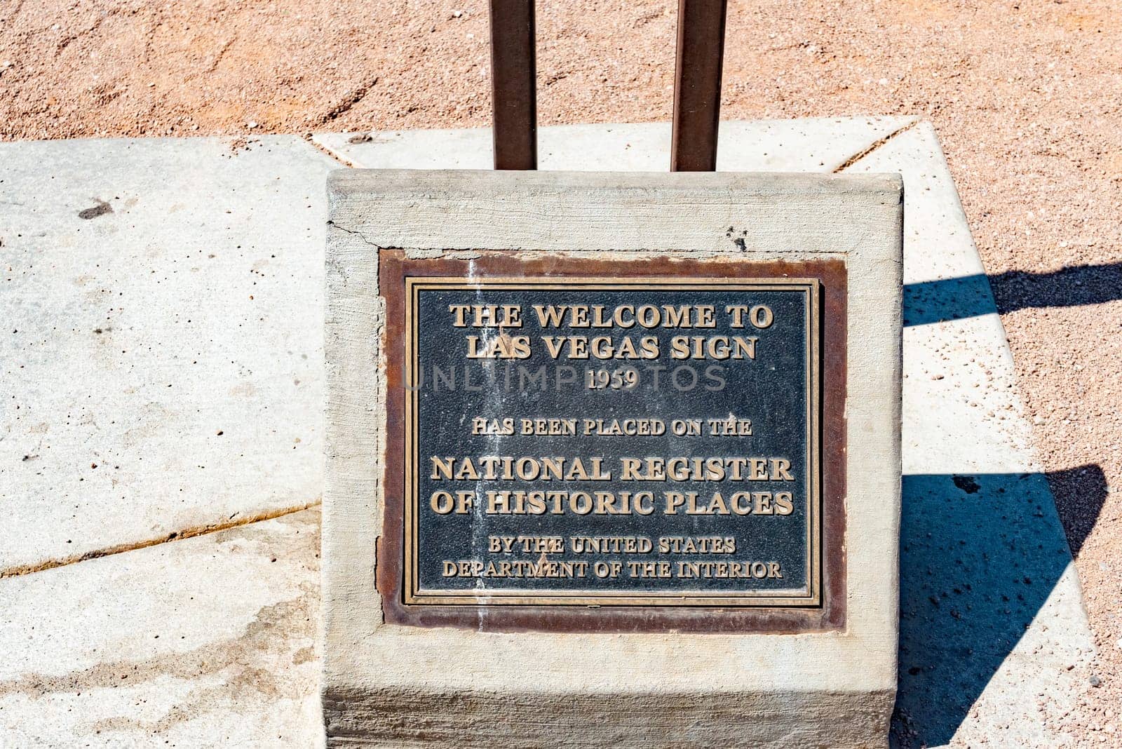Las Vegas, USA - May 25, 2022: explanation of the history of the famous Las Vegas welcome sign at a metal plate for tourists.