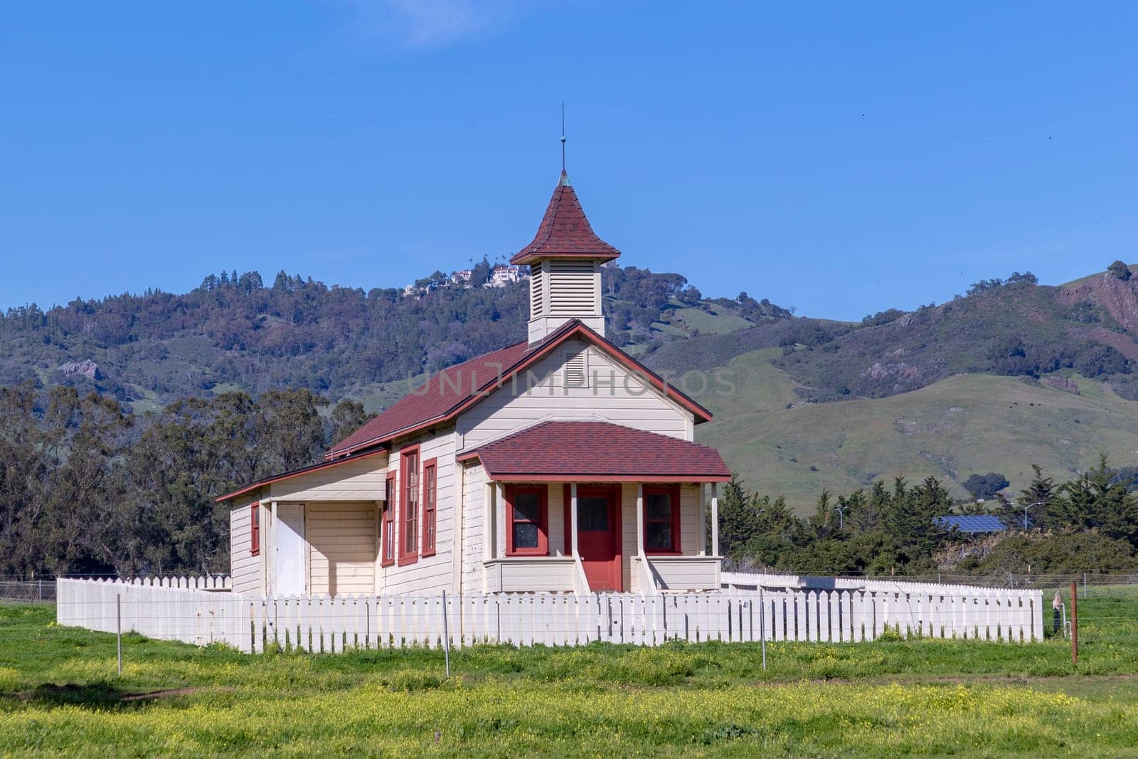 San Simeon, USA - March 15, 2019:  Located just off Highway 1, and in the shadow of Hearst Castle, this restored schoolhouse has been standing since 1903.