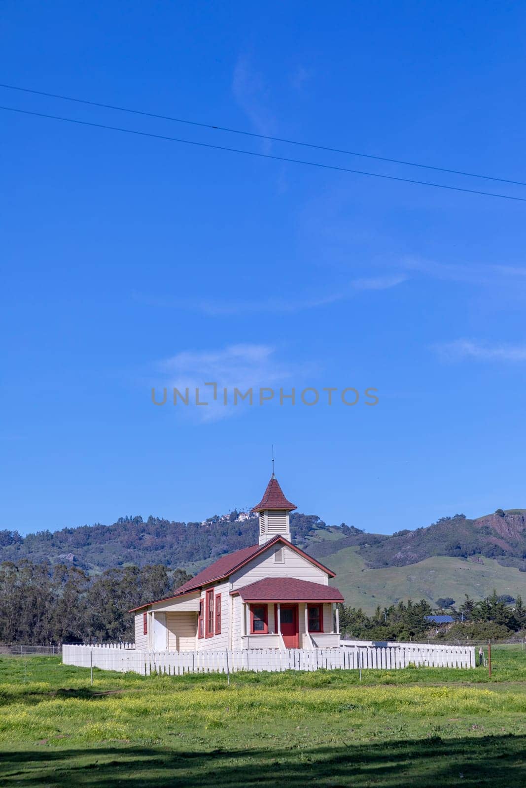 San Simeon, USA - March 15, 2019:  Located just off Highway 1, and in the shadow of Hearst Castle, this restored schoolhouse has been standing since 1903.