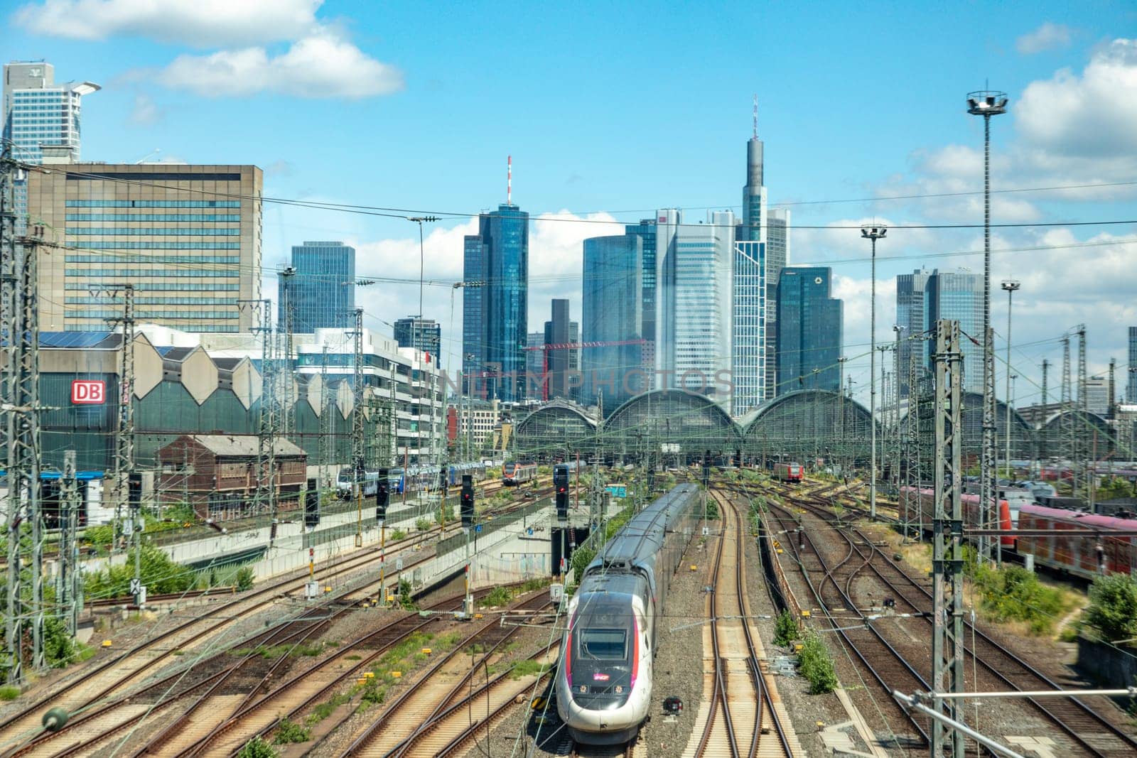 Frankfurt, Germany - June 21, 2021: entrance of Frankfurt central train station with skyline in background