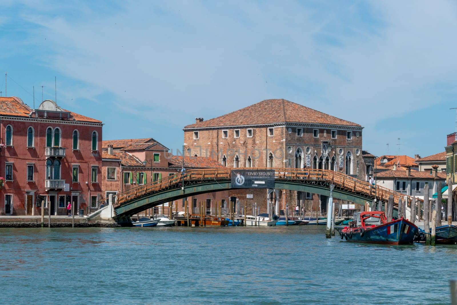 Venice, Italy - July 1, 2021: entering the canal in Murano, the traditional glass manufactoring island of Venice, Italy.