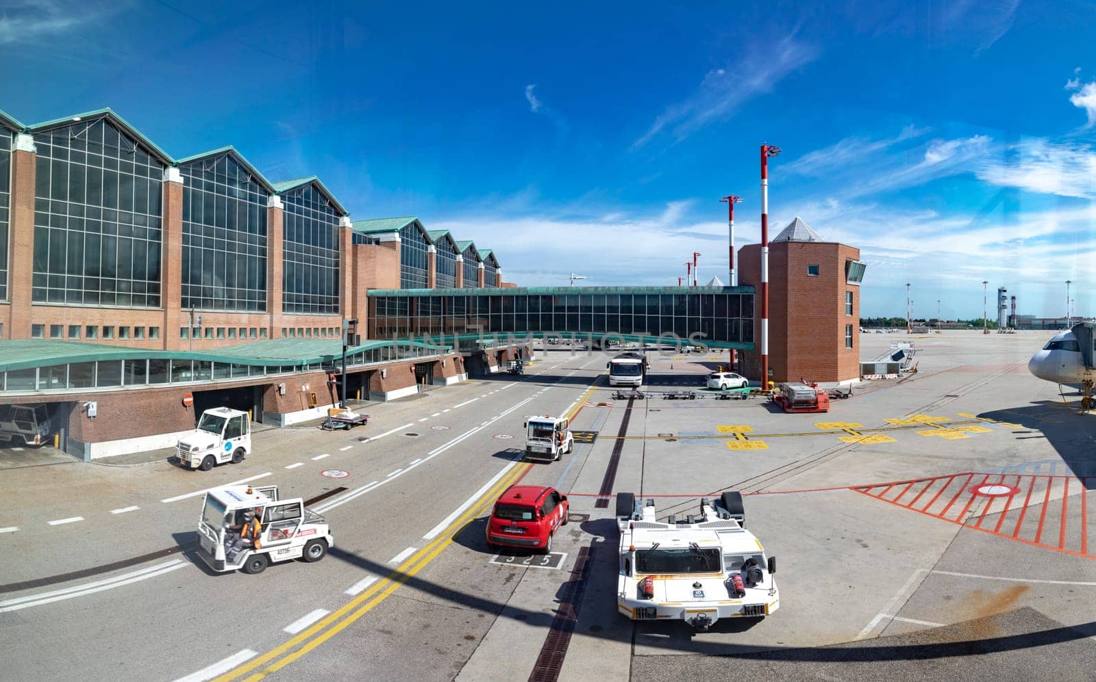 venice, Italy - July 1, 2021: apron at the  Venice Airport Marco Polo with modern departure hall.