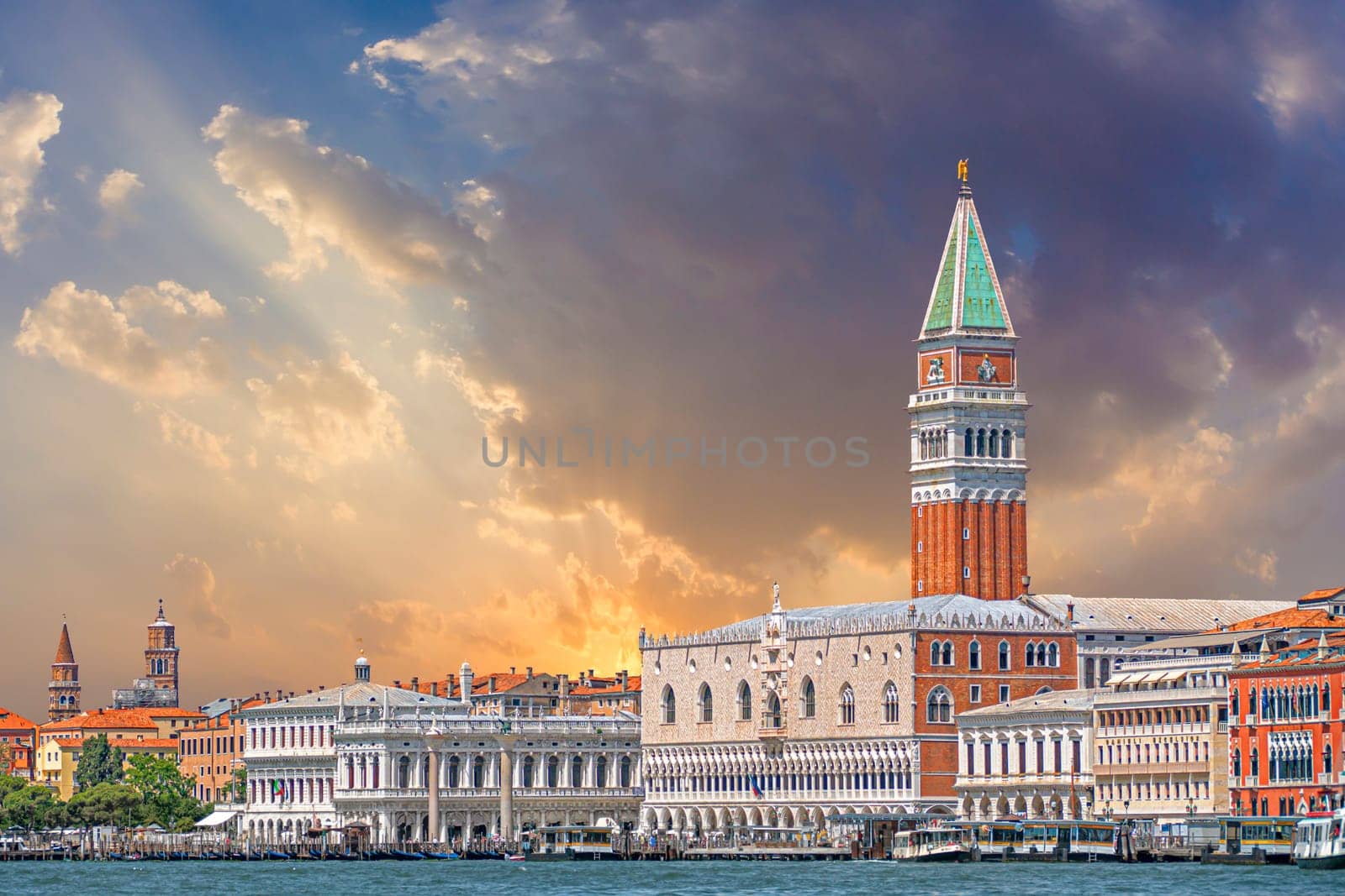 Venice, Italy - July 1, 2021: view to skyline of Venice with campanile and the doges palace under dramatic sky