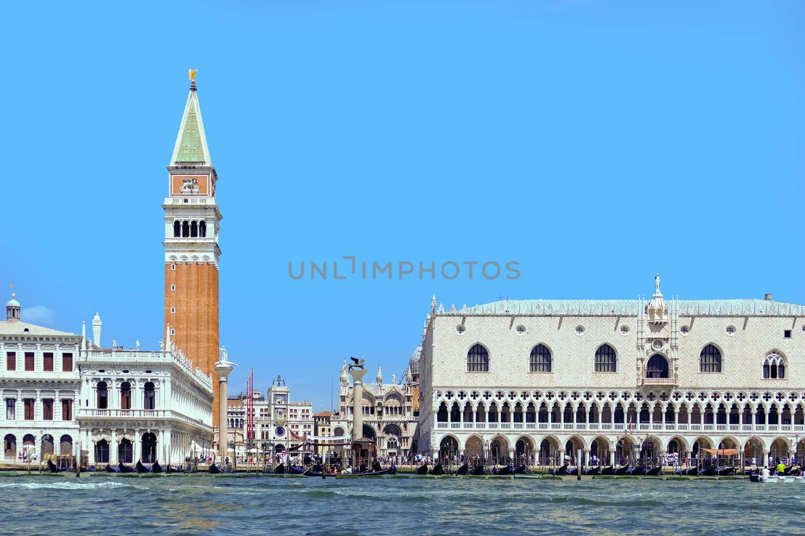 Venice, Italy - July 1, 2022: view to marcus square in venice with the palace of the doges from seaside, Italy.