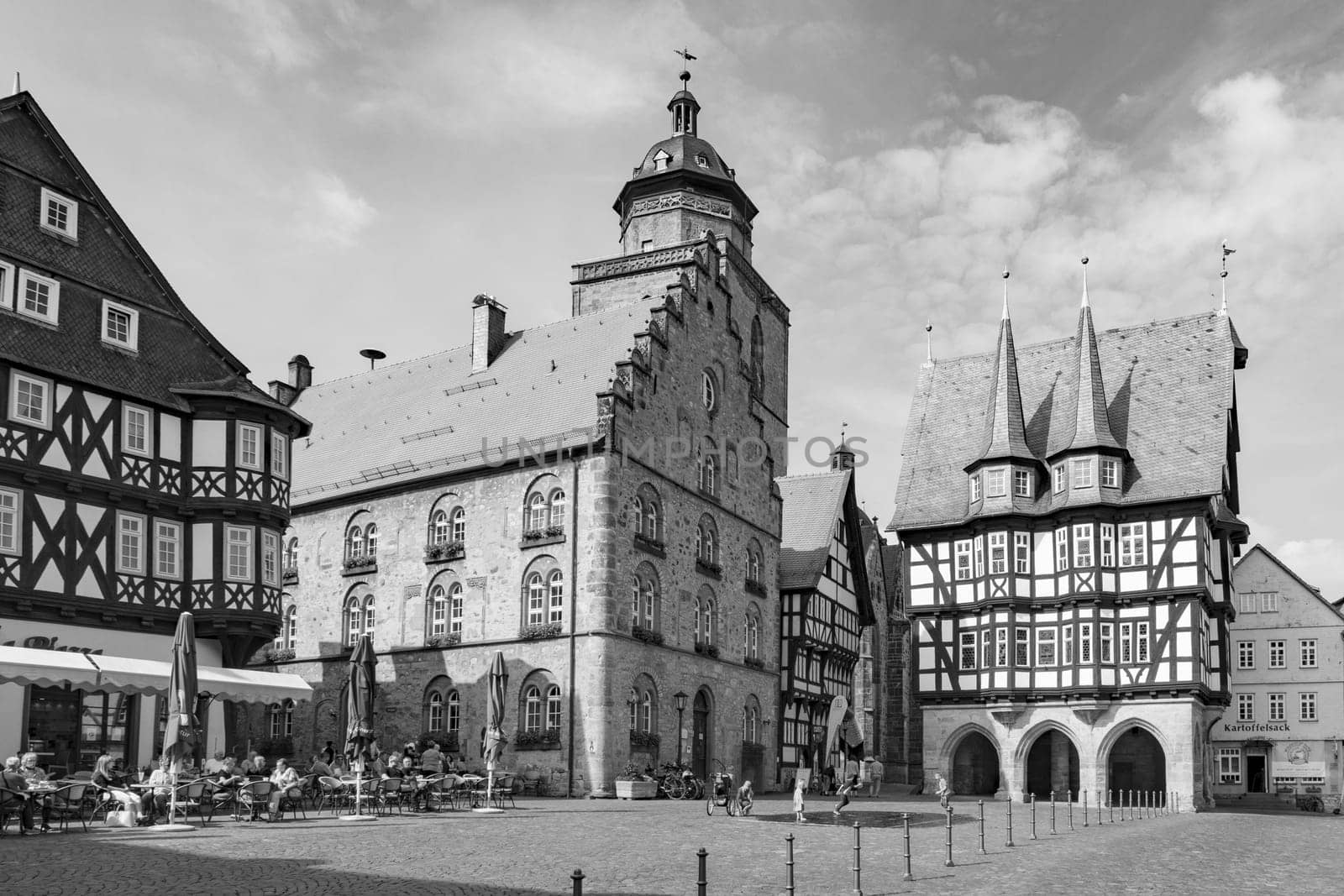 Alsfeld, Germany - June 25, 2021: famous town hall and half timbered historic houses at central square in Alsfeld, germany.