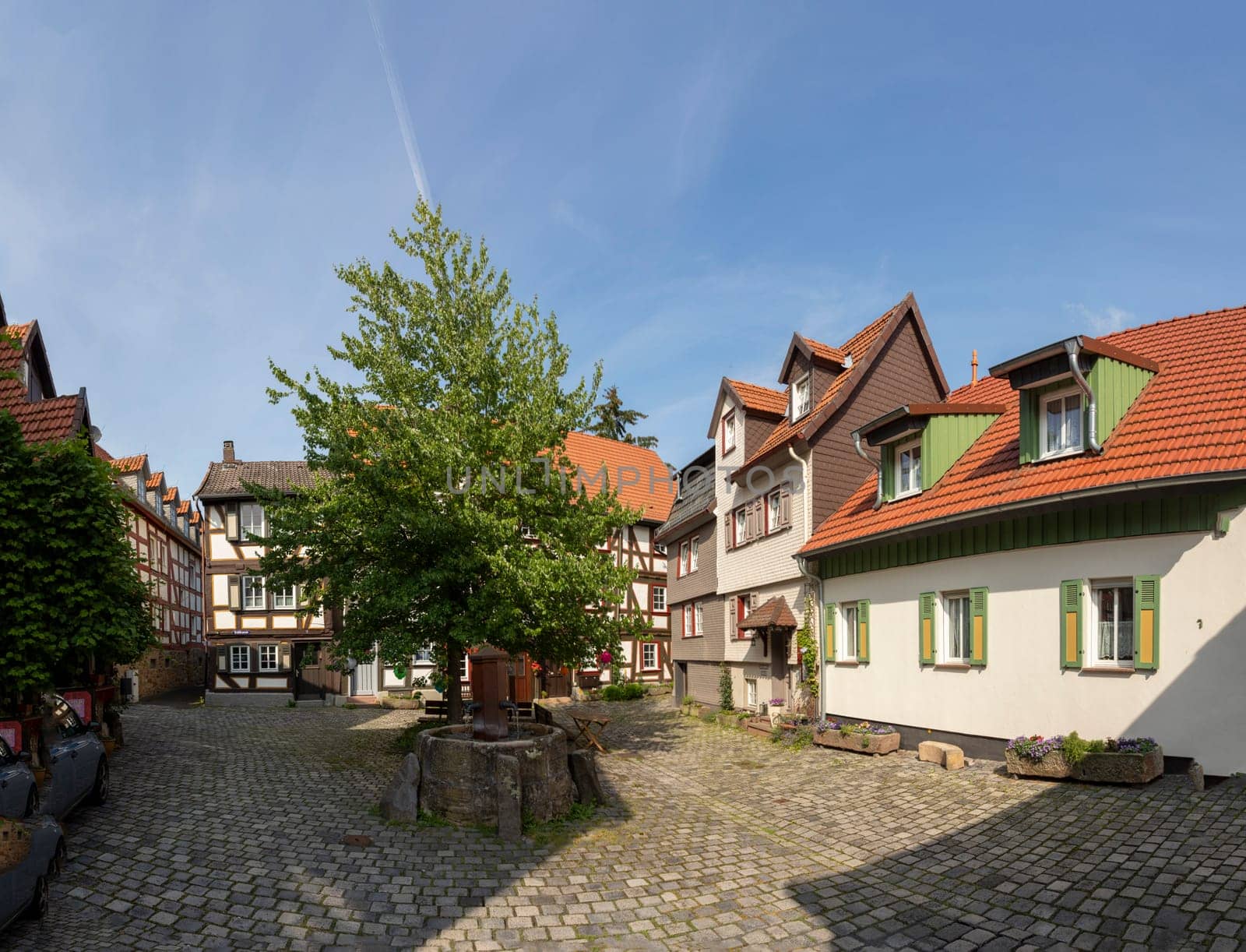 Alsfeld, Germany - June 25, 2021: famous town hall and half timbered historic houses at central square in Alsfeld, germany.