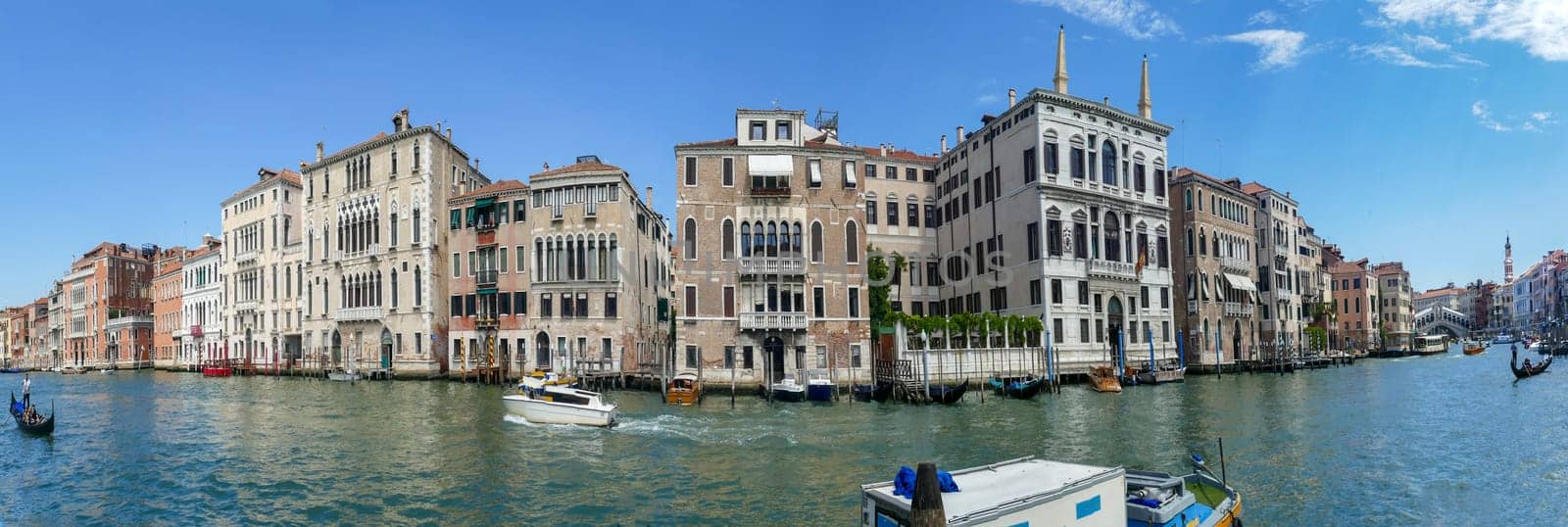 Venice, Italy - July 2, 2021: scenic view of the grand canal in Venice with old palaces and boats at the waterway.