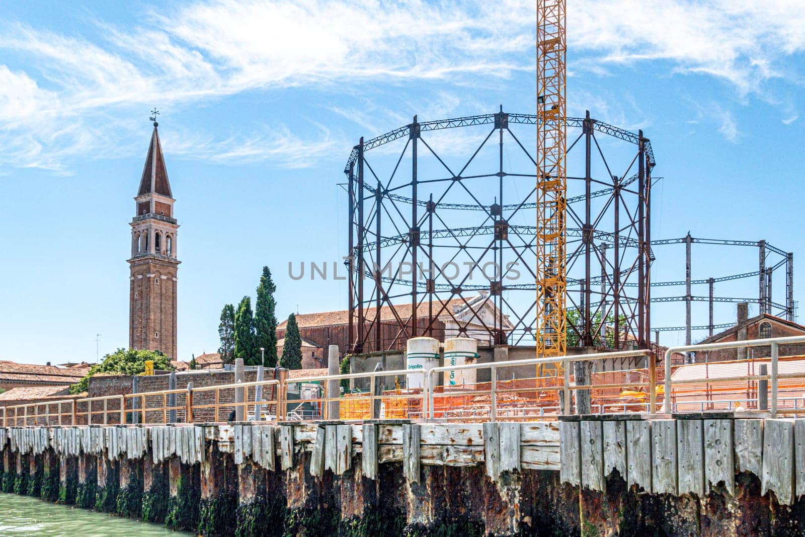 Venice, Italy - July 1, 2021: ferry station Venier, view to empty gas tanks in Venice, Italy.