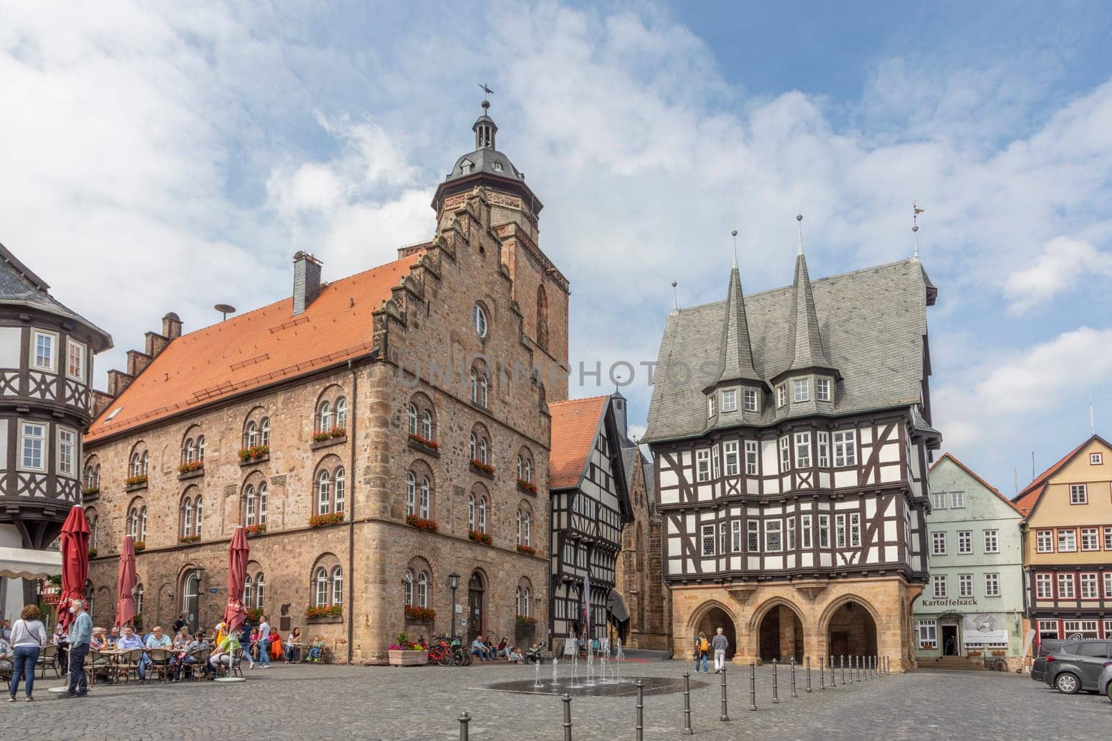 Alsfeld, Germany - June 25, 2021: famous town hall and half timbered historic houses at central square in Alsfeld, germany.