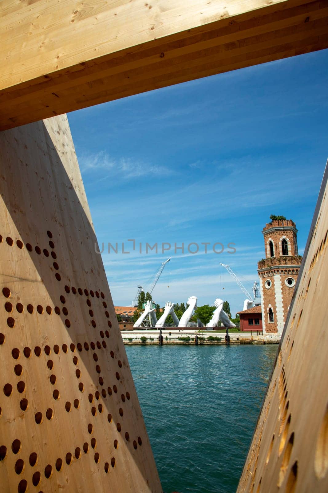 Venice, Italy - July 3, 2021: Lorenzo Quinn's Giant Stone Hands Represent Humanity’s Universal Values At Venice Art Biennale in Venice, Italy.